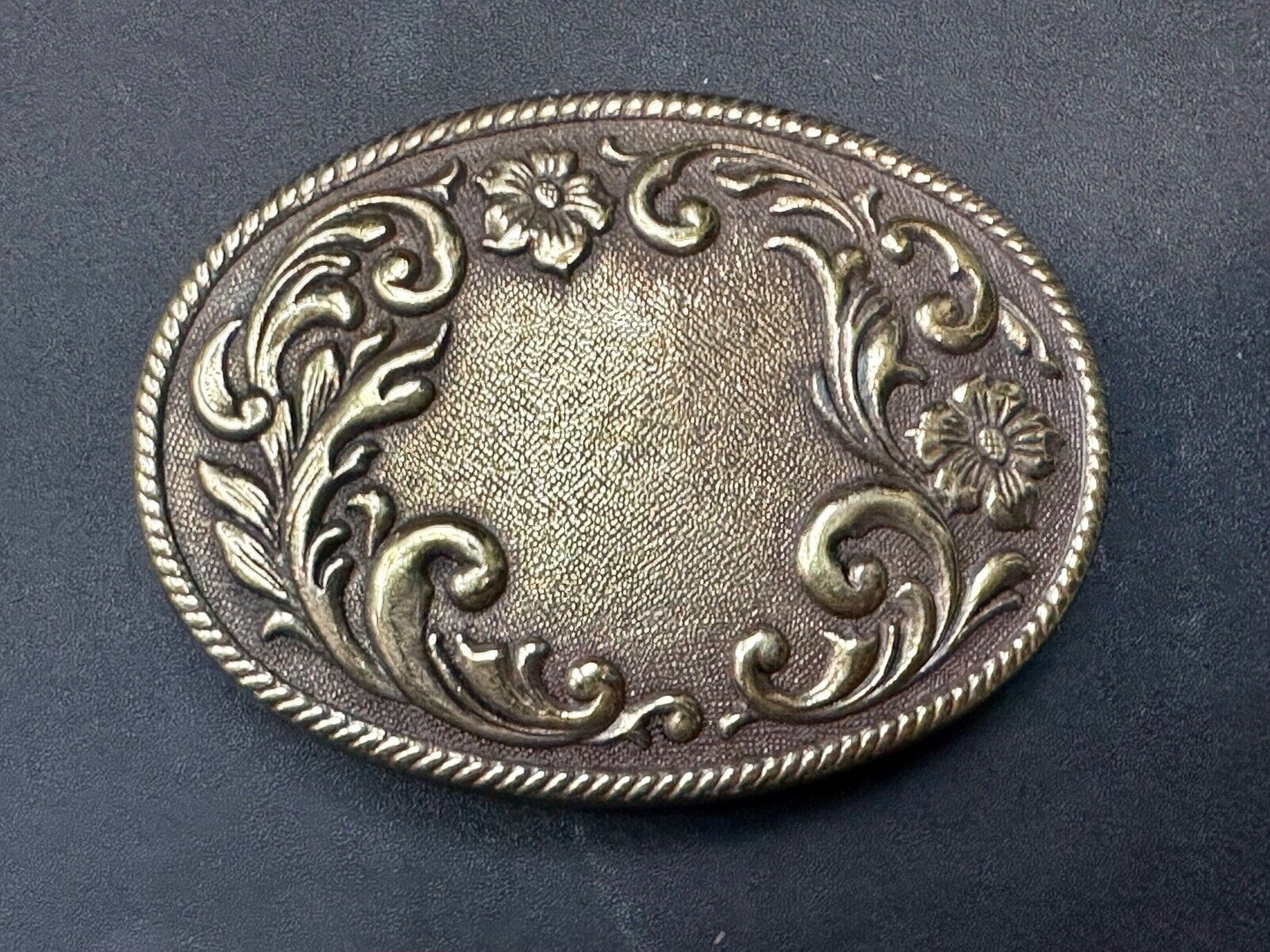 USA made vintage western flower swirl design oval belt buckle marked W