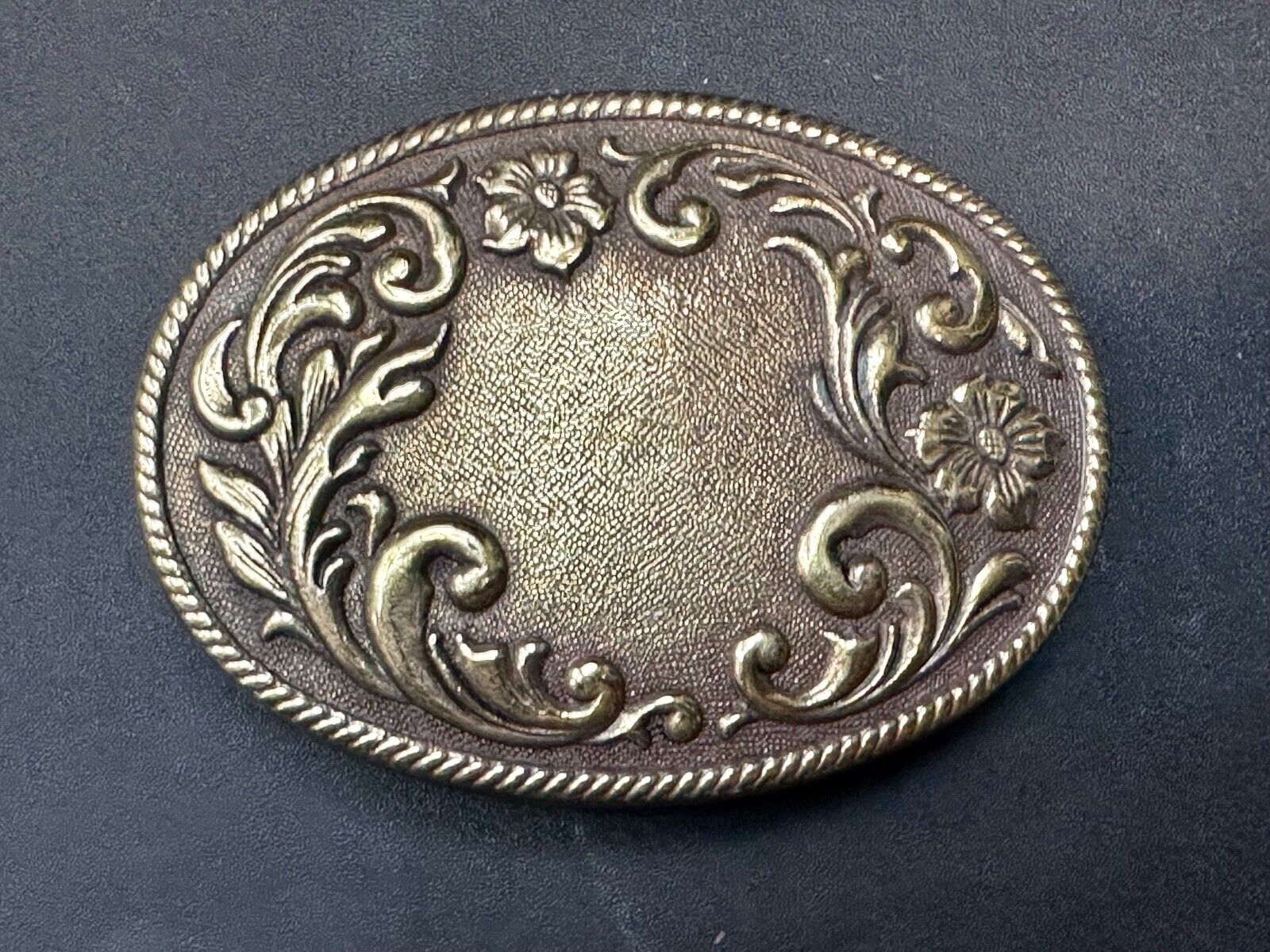 USA made vintage western flower swirl design oval belt buckle marked W