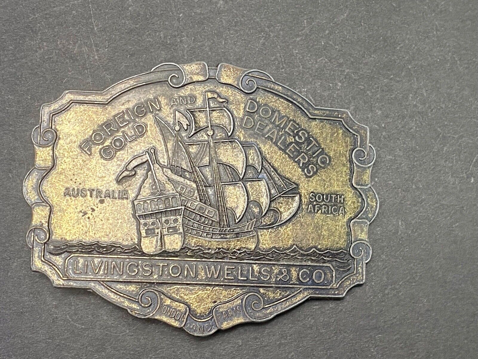 VINTAGE ANTIQUE METAL BELT BUCKLE- Livingston Wells & Co Sailboat Ship