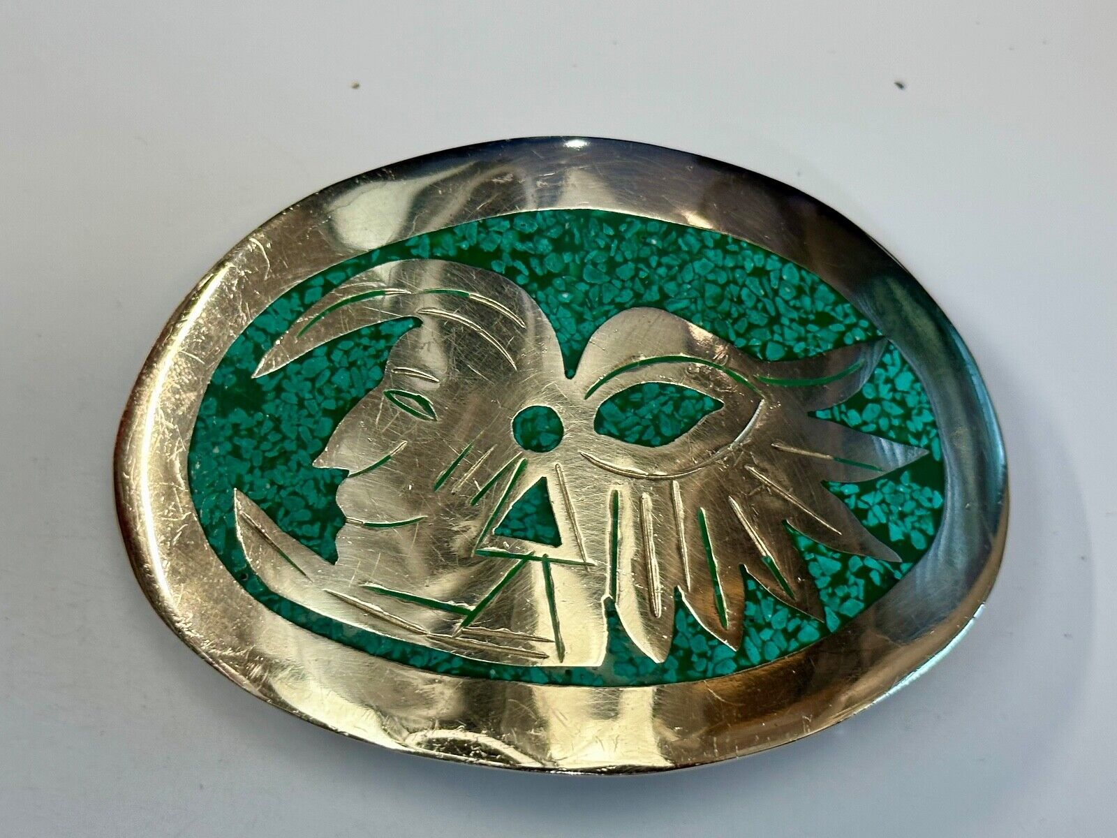 Tribal Face - Inlaid Turquoise chip to Alpaca stamped oval Belt Buckle