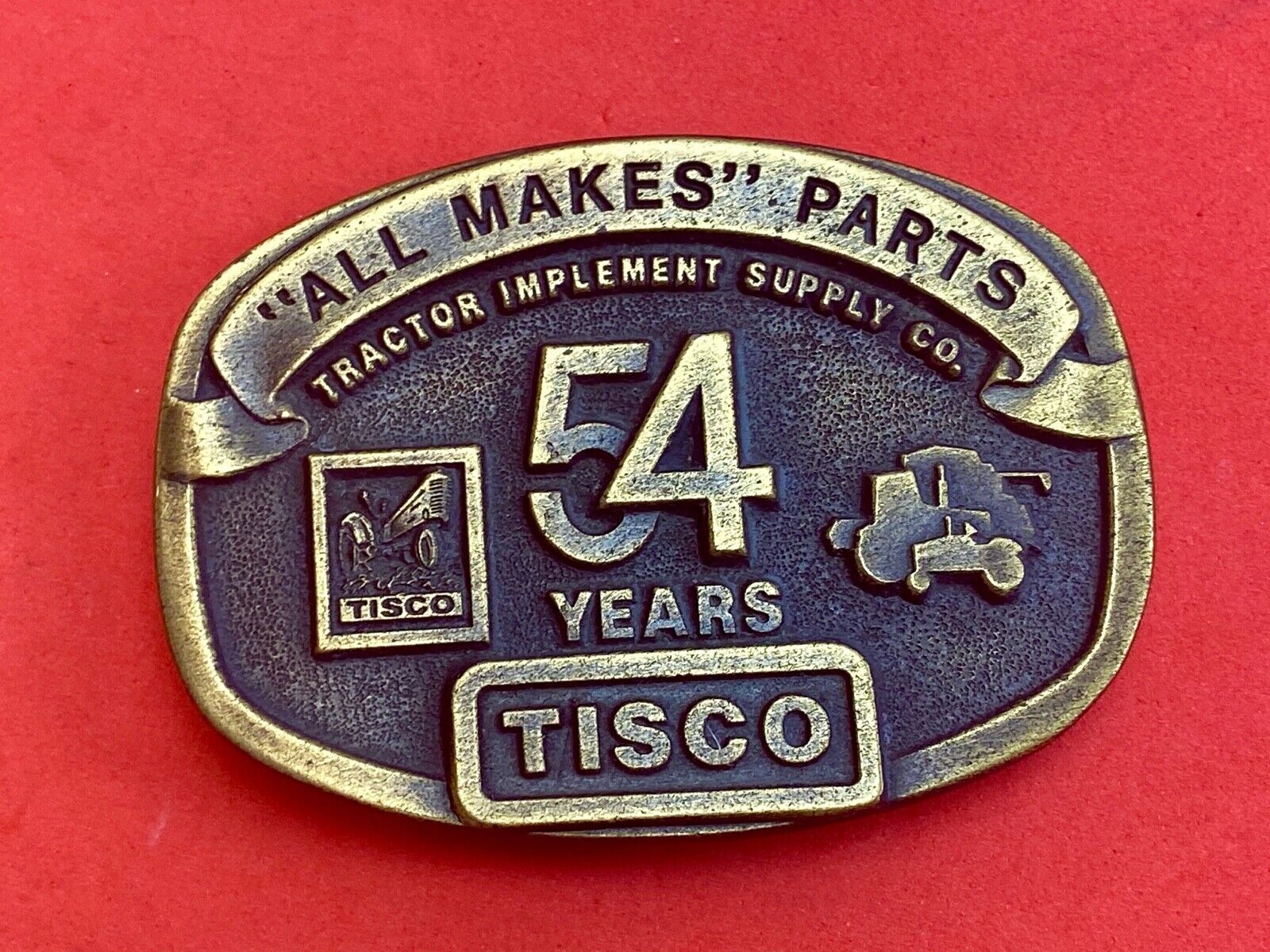 54 years Tisco Tractor Implement Supply Spec Cast Brass Belt Buckle series 2
