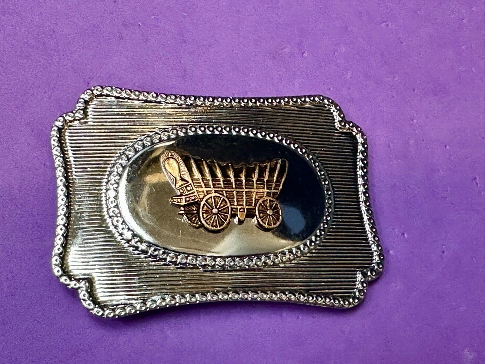 Vintage covered wagon western horse drawn transportation belt buckle