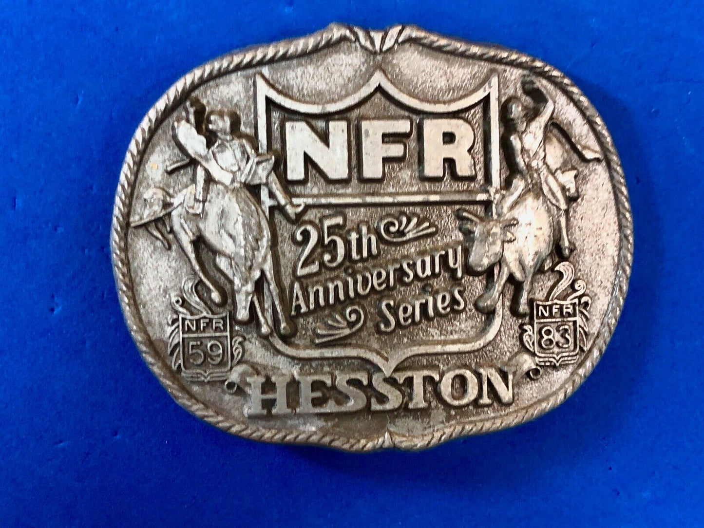25th Anniversary 1959-1983 Hesston National Finals Rodeo belt buckle FIRST EDN.