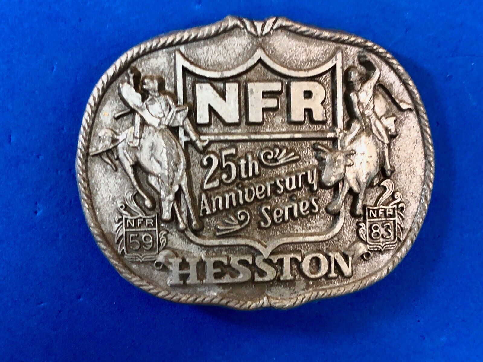 25th Anniversary 1959-1983 Hesston National Finals Rodeo belt buckle FIRST EDN.