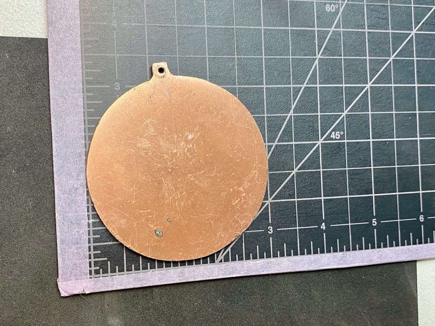 award round medal from El Tour De Tucson HUNGER Race