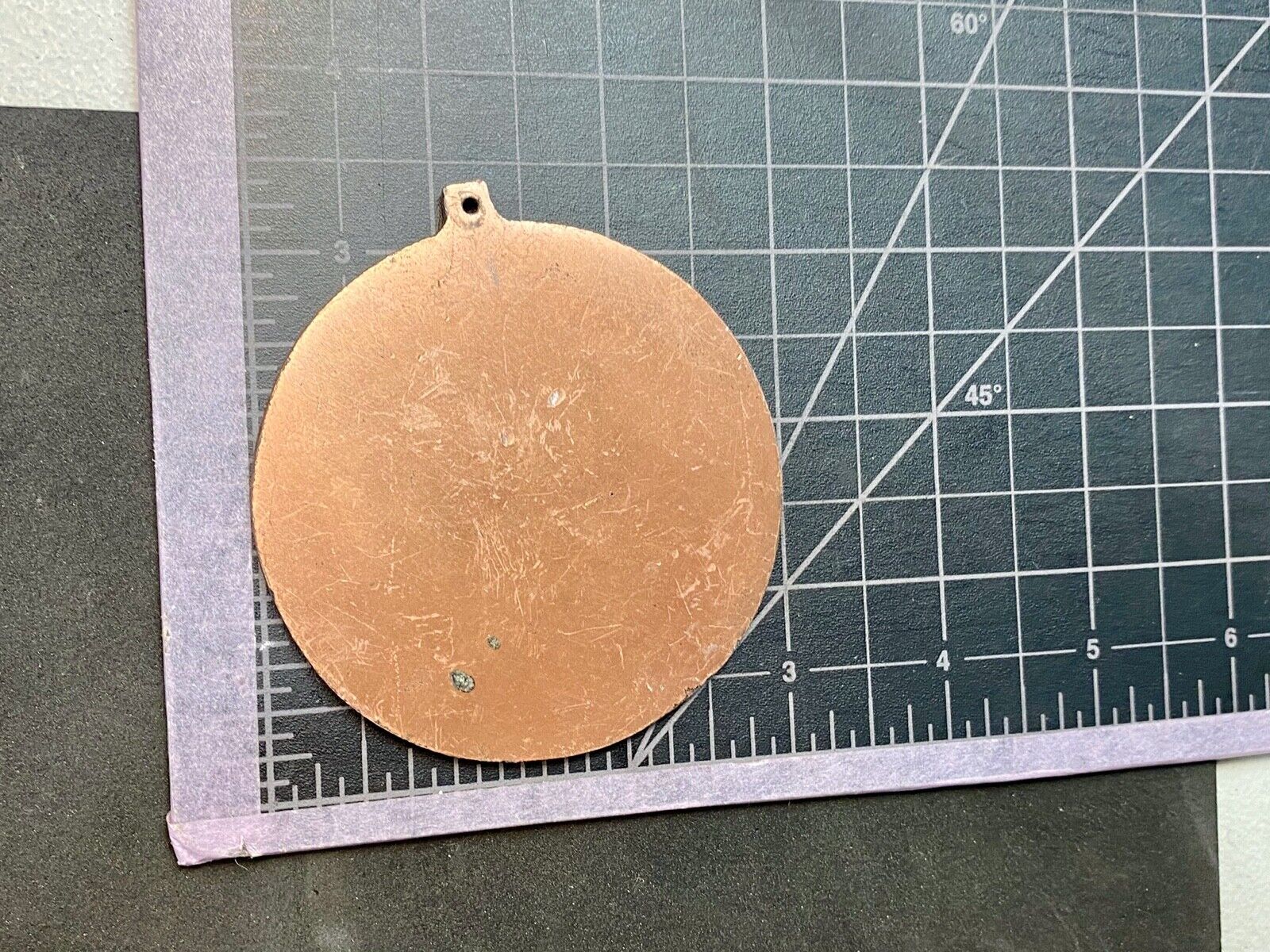 award round medal from El Tour De Tucson HUNGER Race