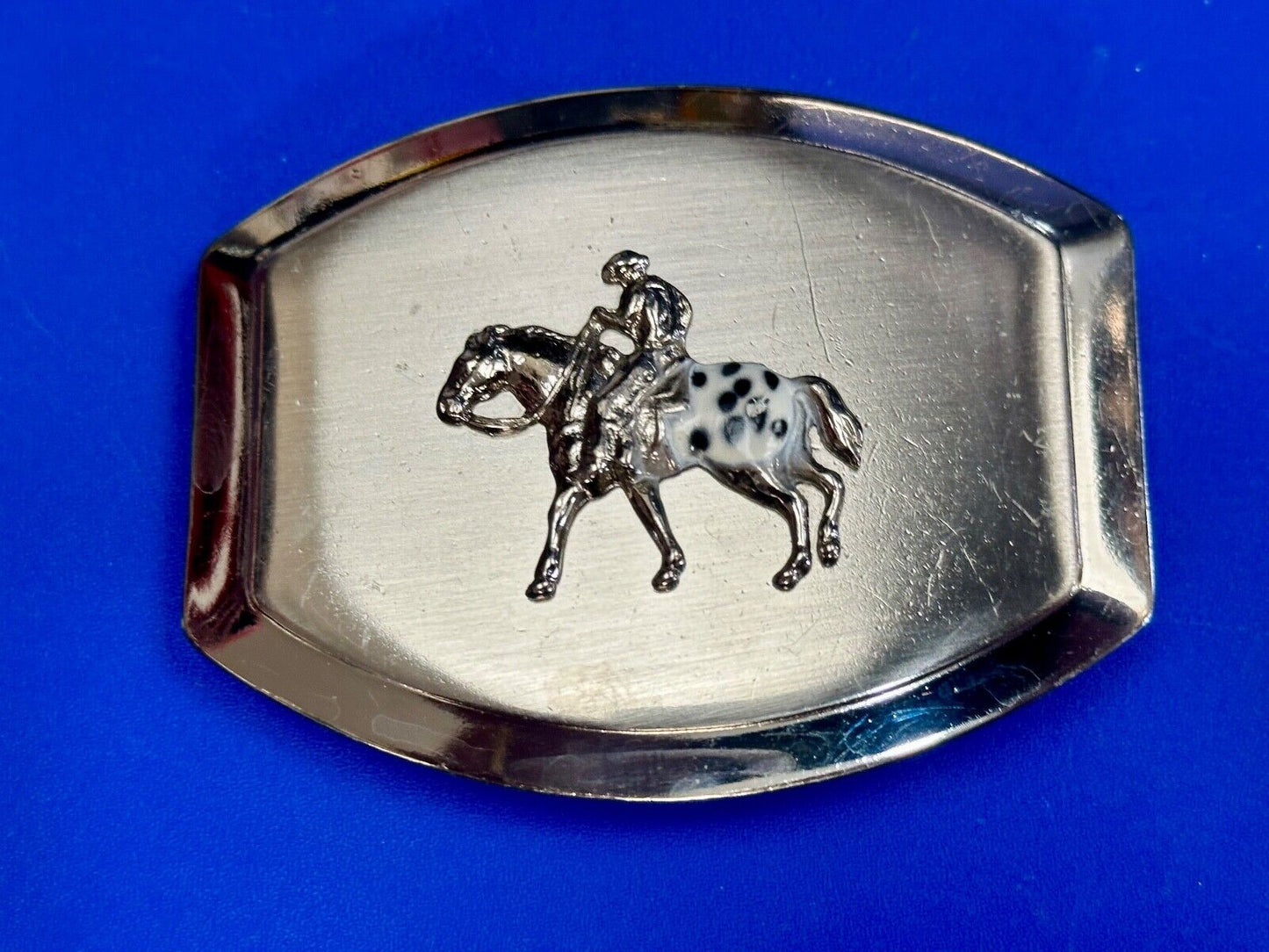 Vintage Horseback Riders cowboys belt buckle with black & white enamel accents