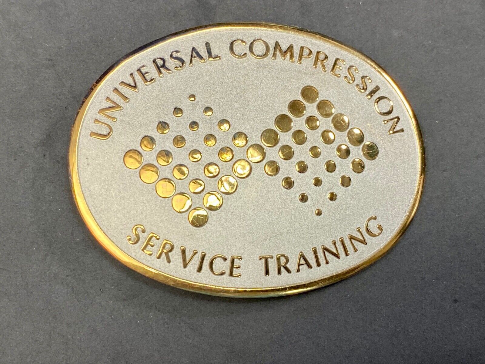 Universal Compression Service Training Company Award Belt Buckle