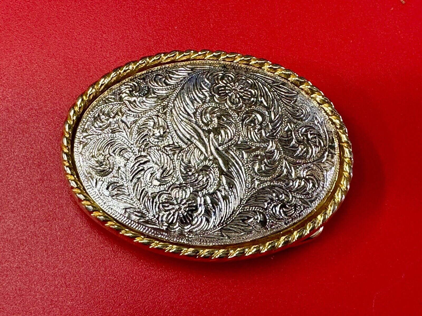 vintage Ivan Brand western flower swirl design two tone oval belt buckle