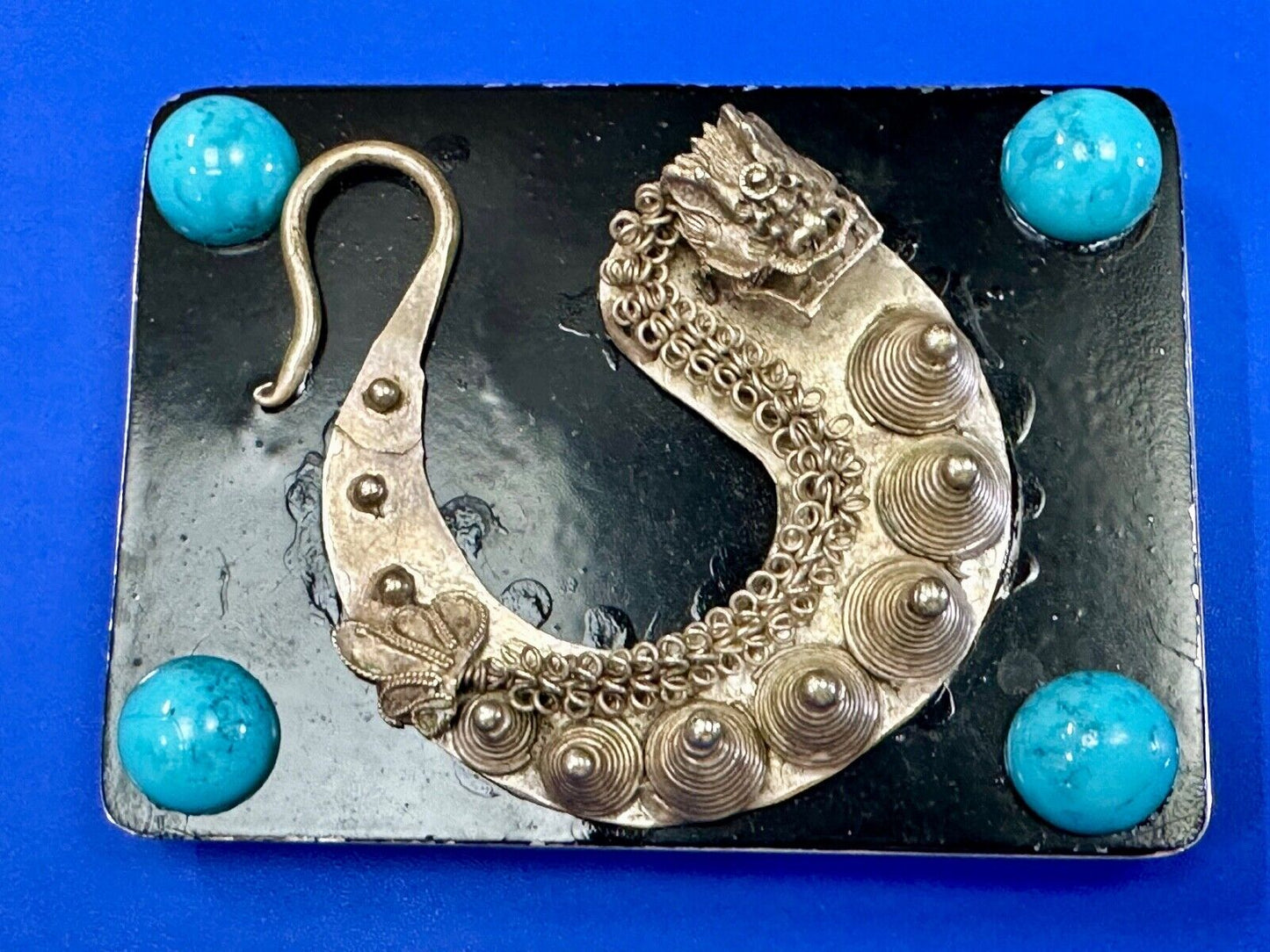 Artisan Dragon theme rectangular belt buckle with turquoise colored corner accts
