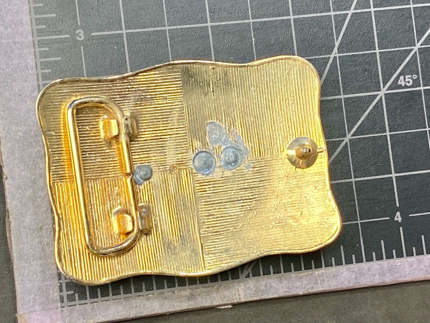 bull riding rodeo cowboy on beautiful gold color flower swirl belt buckle 