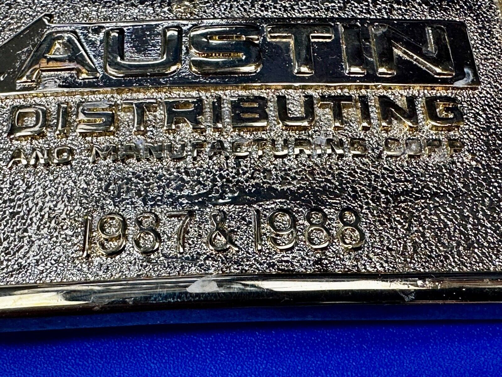 Austin Texas Distributing and Manufacturing 1987 Gold Tone Belt Buckle