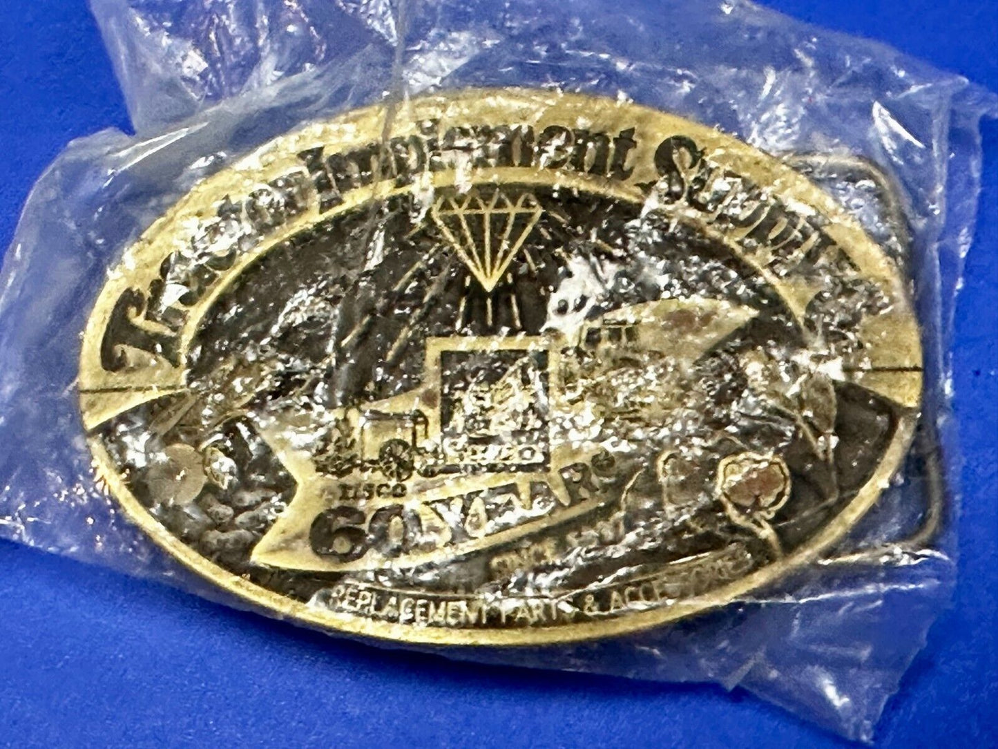 60 Years TISCO Tractor Implement Supply company NOS Belt Buckle by Speccast