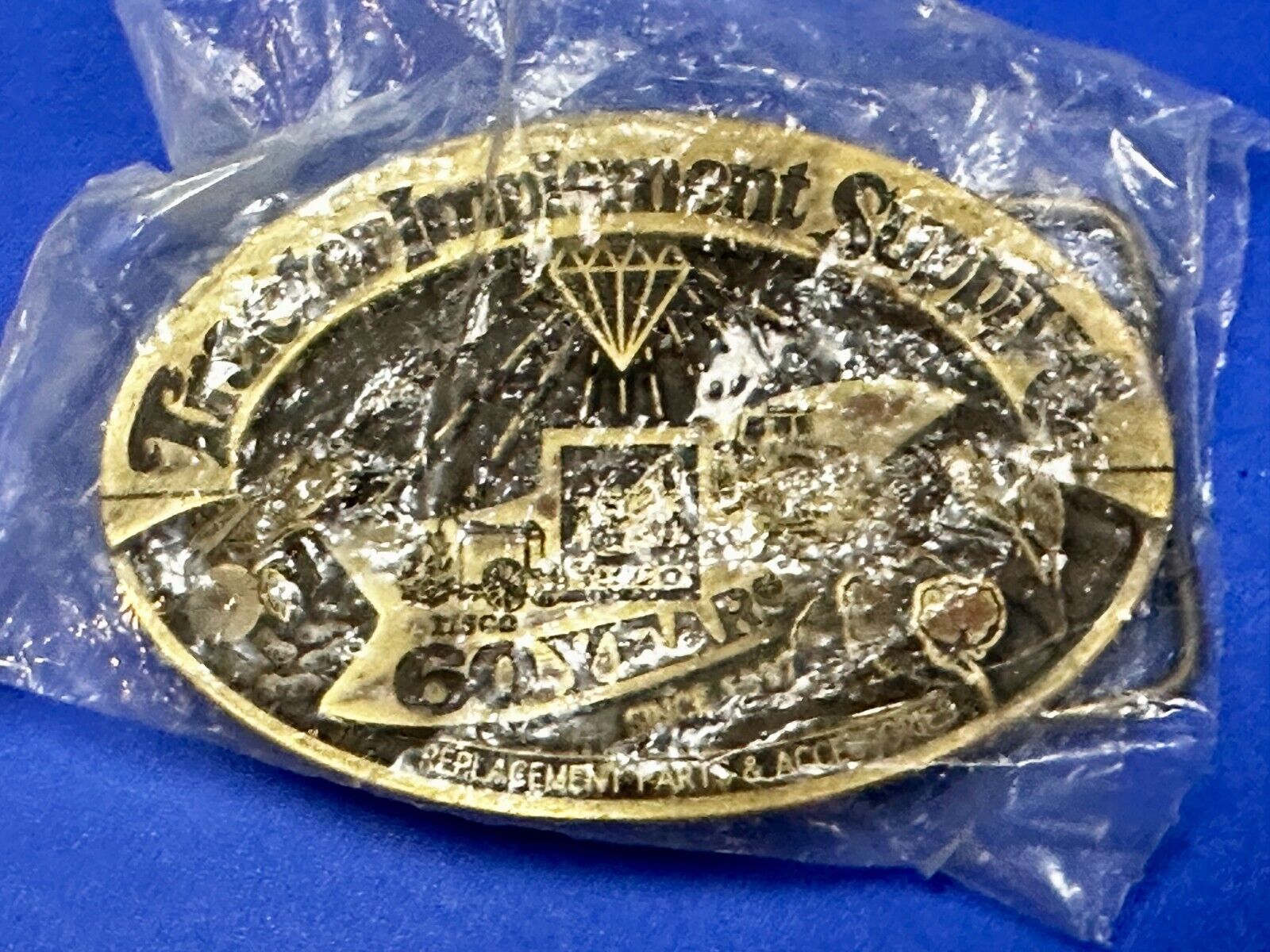 60 Years TISCO Tractor Implement Supply company NOS Belt Buckle by Speccast