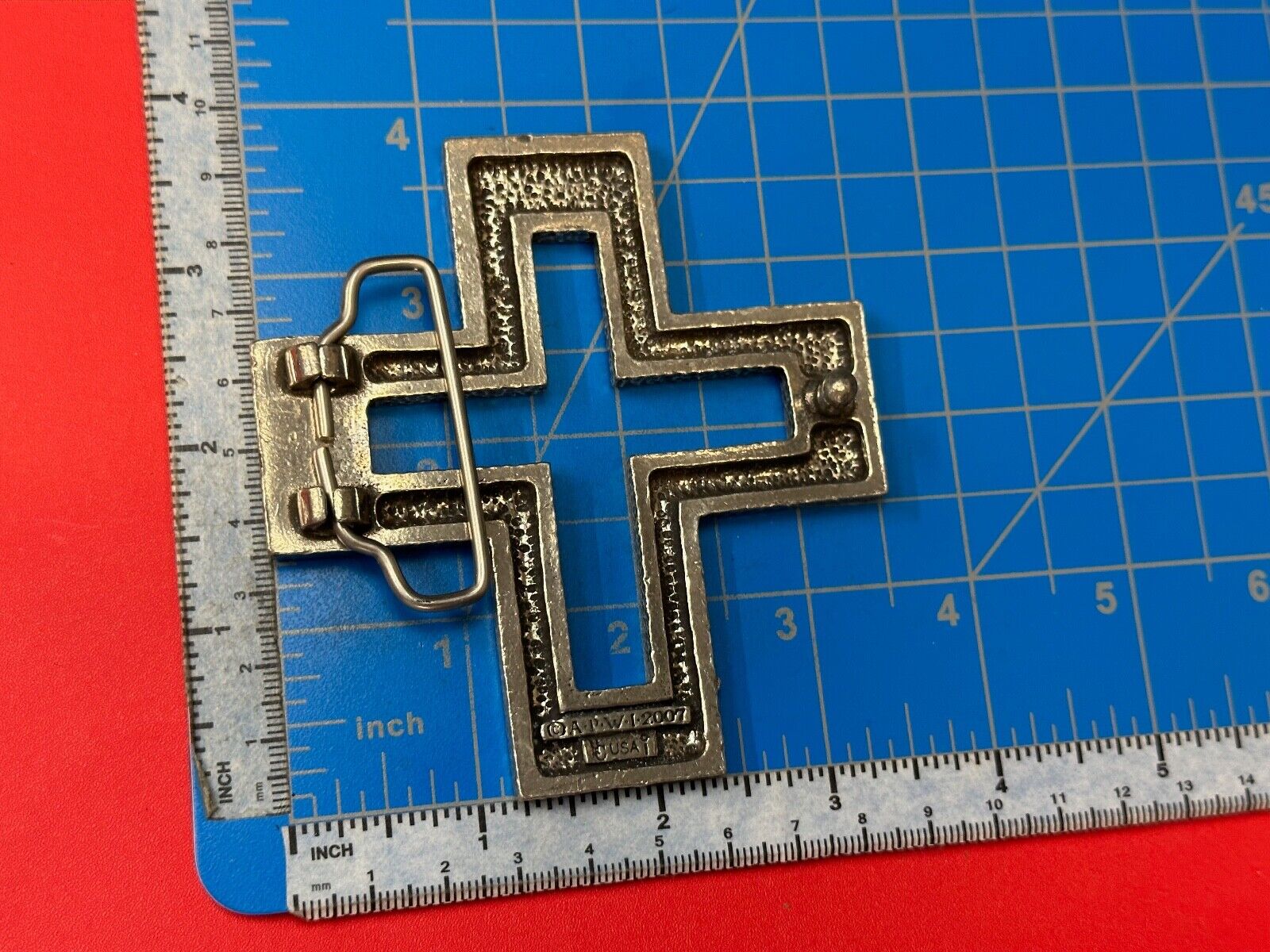 A.P.W. 2007 cross cutout silver tone belt buckle