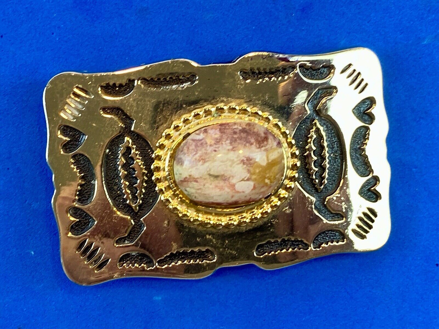 unknown multi layered colored stone as centerpiece in western belt buckle