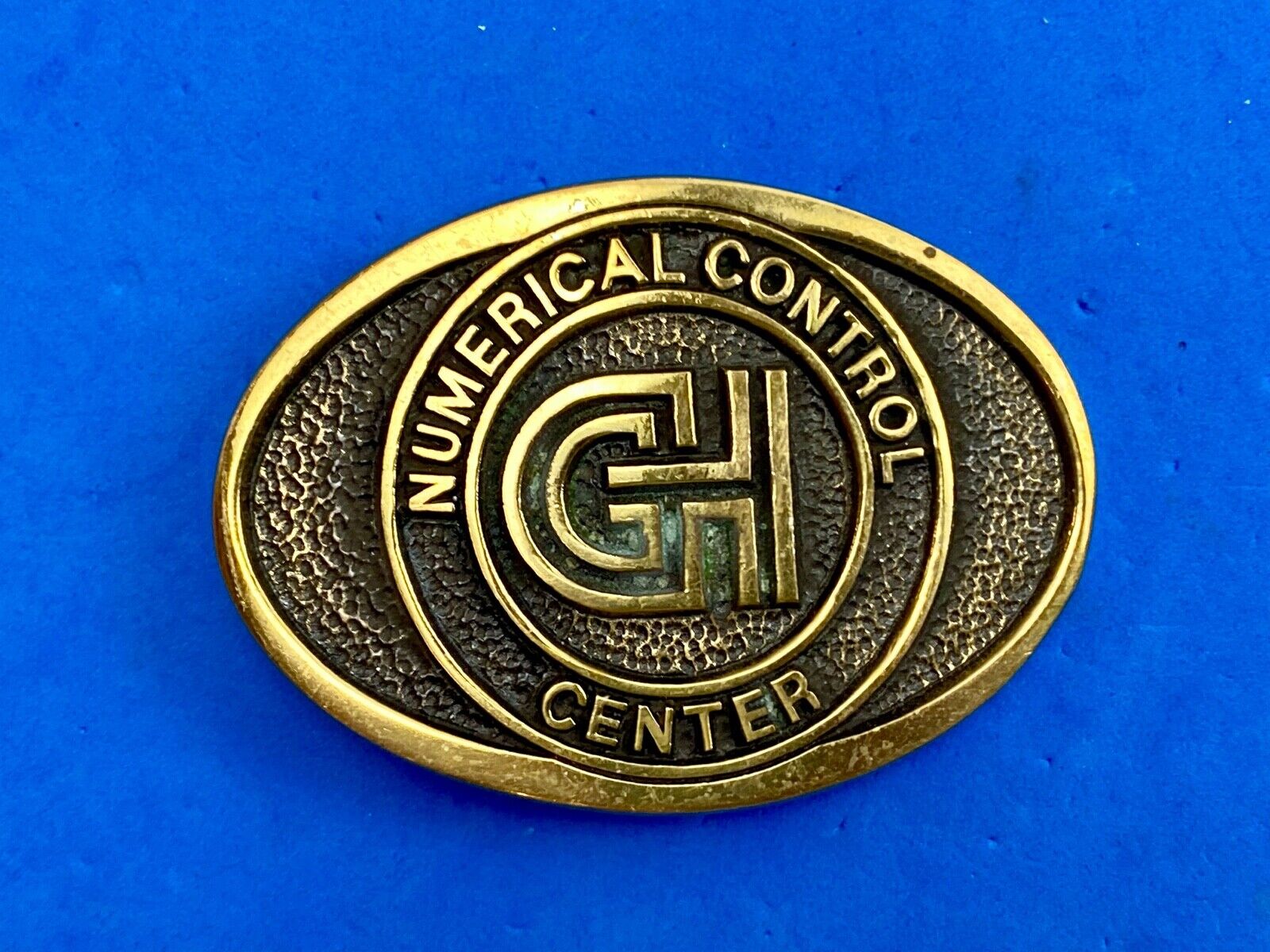 Vintage GH Numerical Control Center solid brass belt buckle by Blue Bayou 