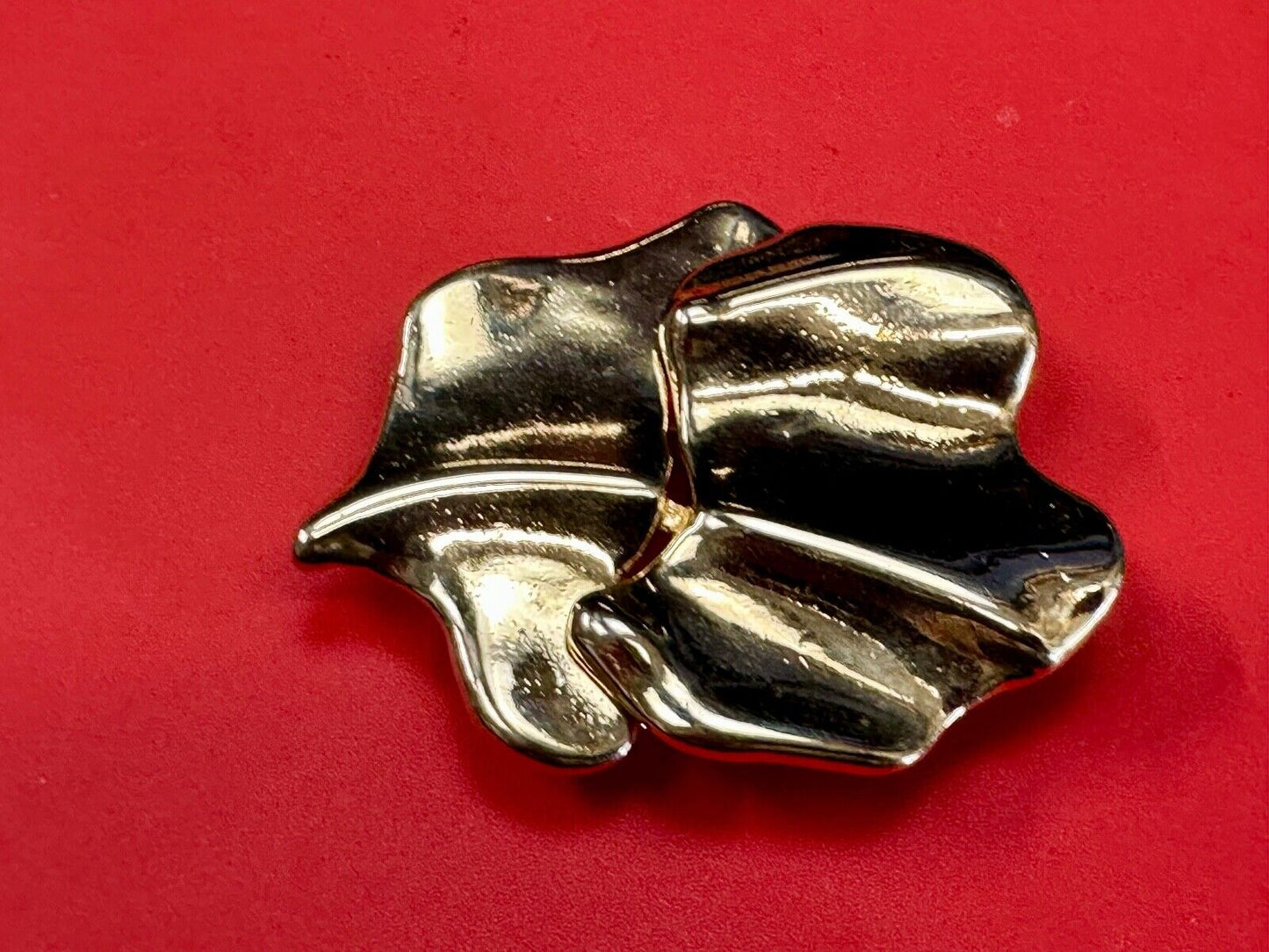 Two-piece interlocking gold tone leaf swirl theme belt slide buckle signed _____