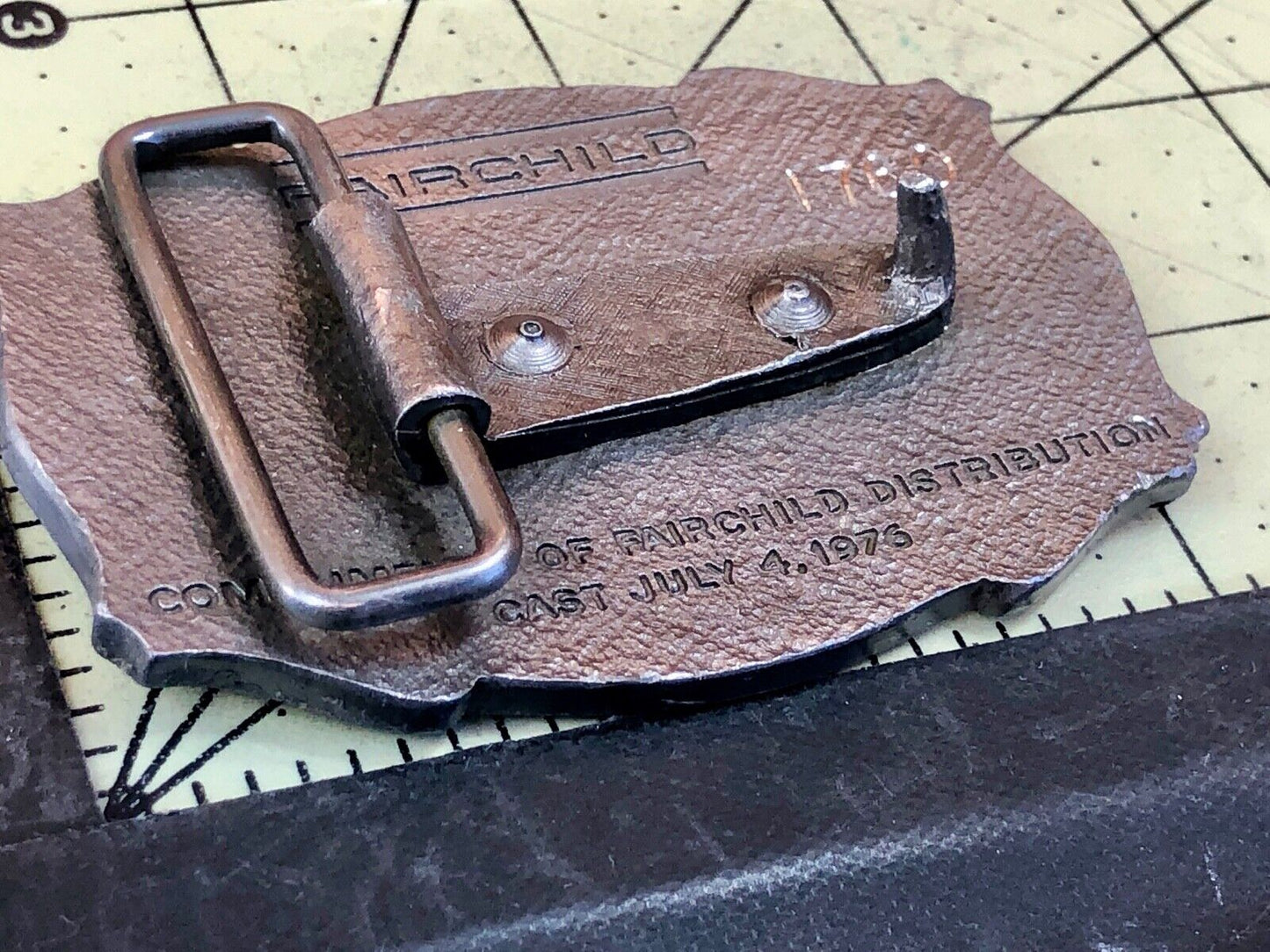 Vintage Fairchild Distribution company logo promotional belt buckle 