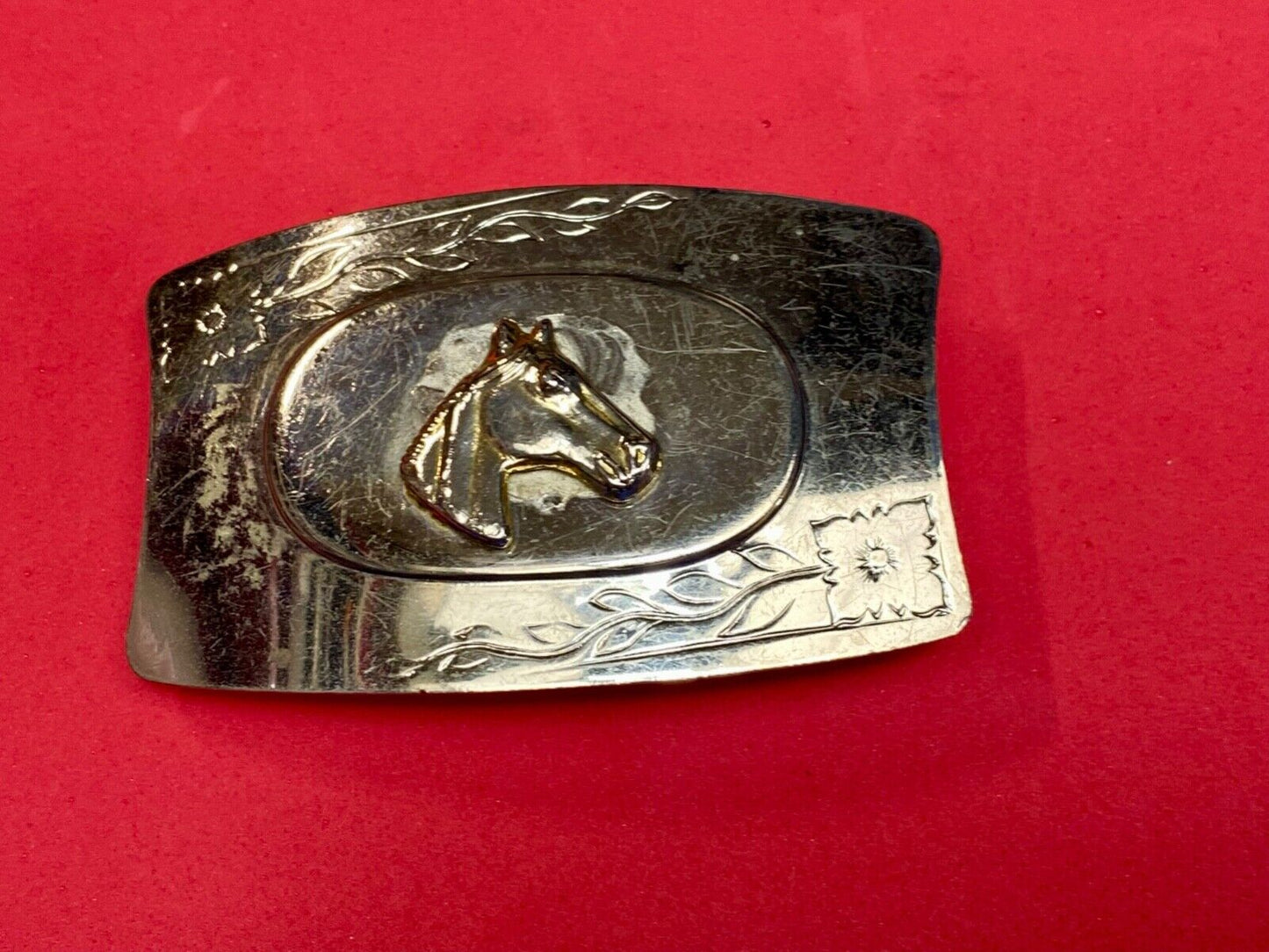Vintage horse head on western belt buckle