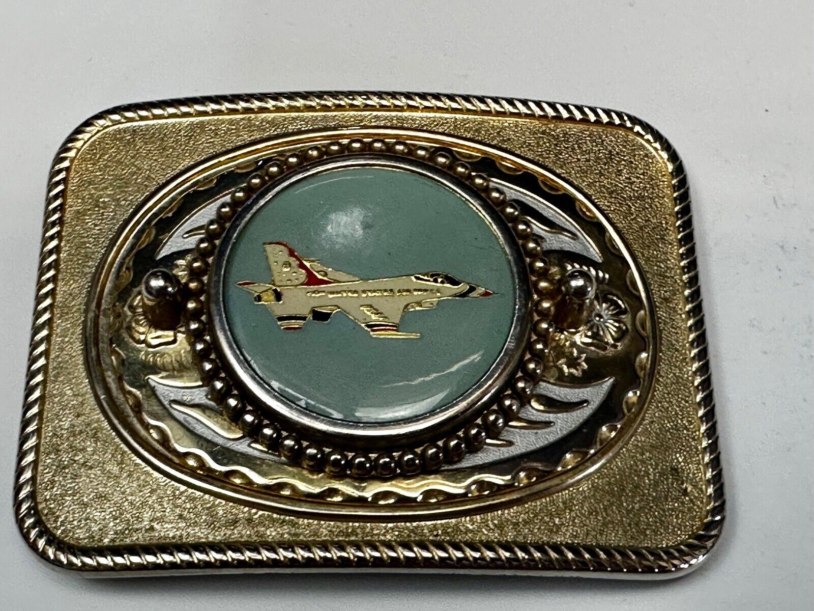 Us Air Force Fighter Jet as centerpiece in western Belt Buckle - or dollar coin