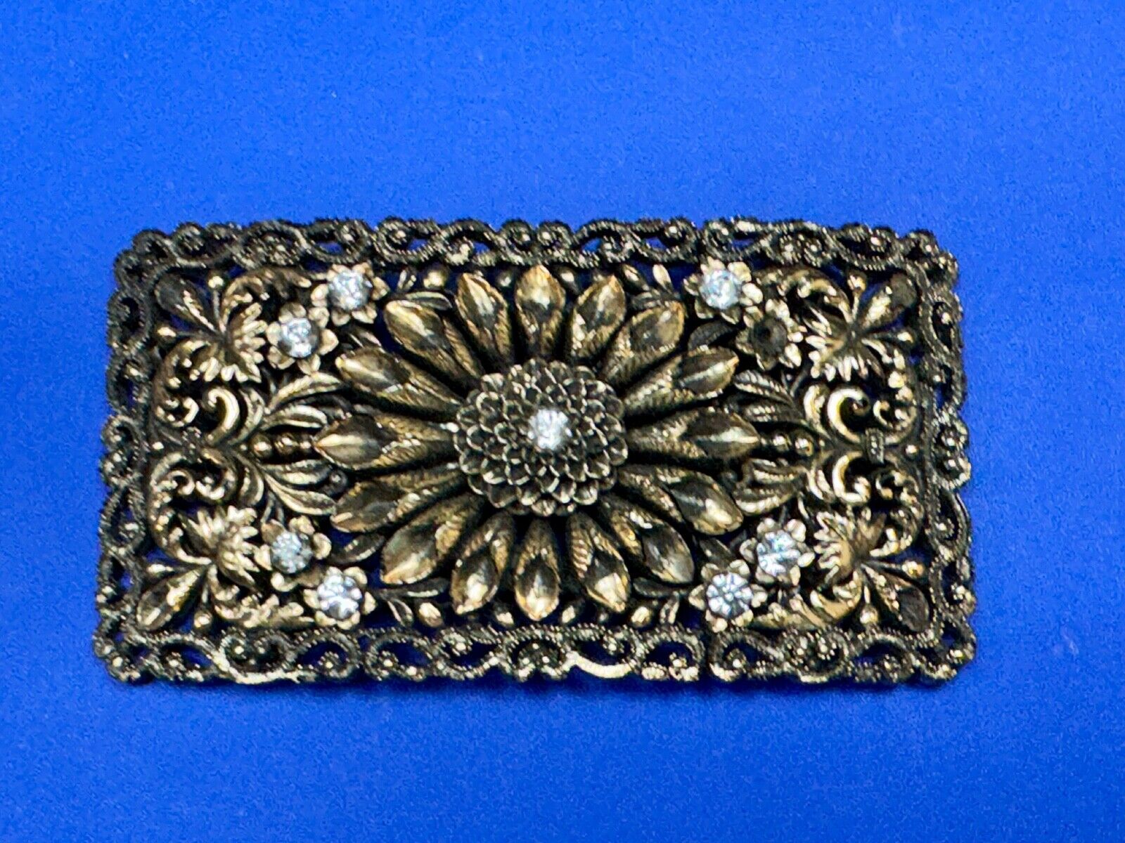 Antique gold tone? Flower theme Rhinestone covered scarf slide belt loupe buckle