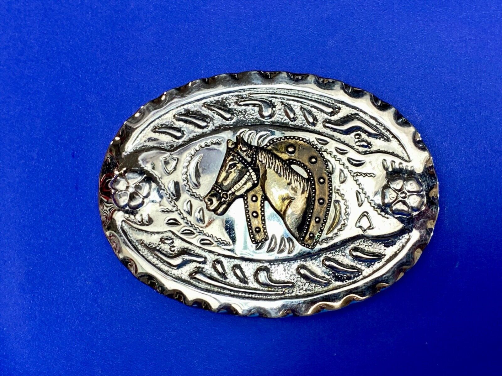 Vintage horse head through lucky horseshoe on mixed metal western belt buckle