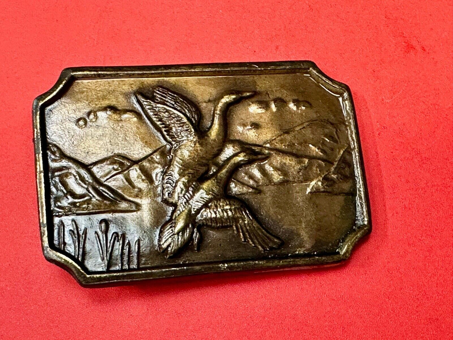 Two ducks flying from pond - Vintage nature scene belt buckle