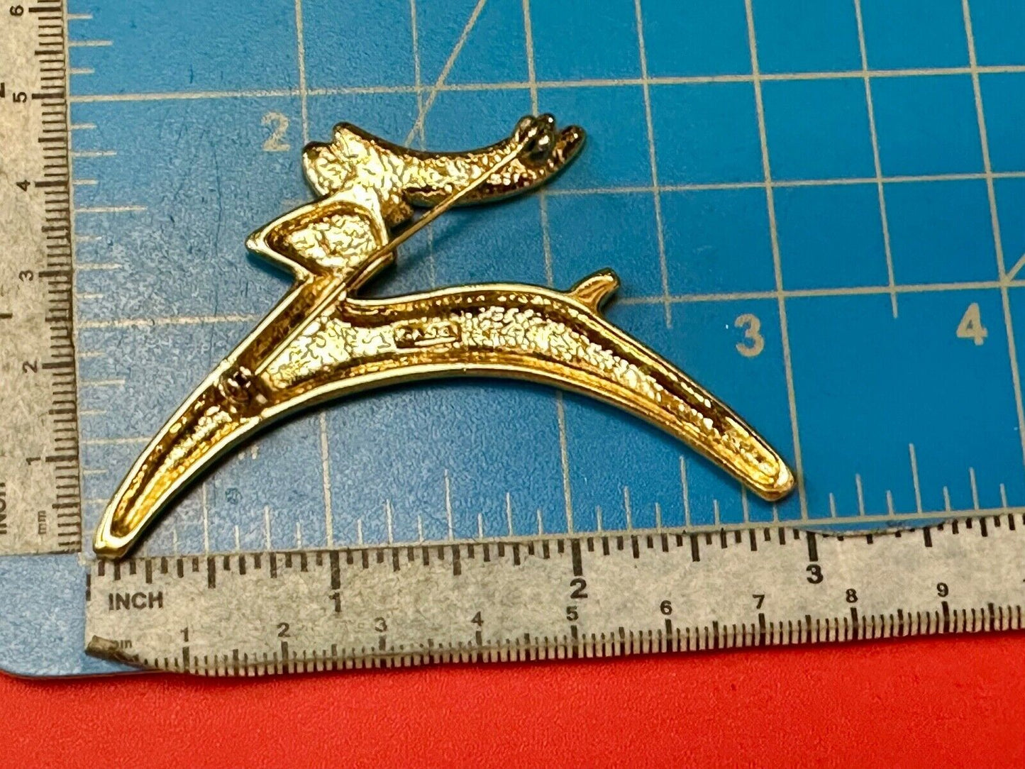 Abstract gold tone running deer - Vintage Christmas Holliday Brooch by AJC