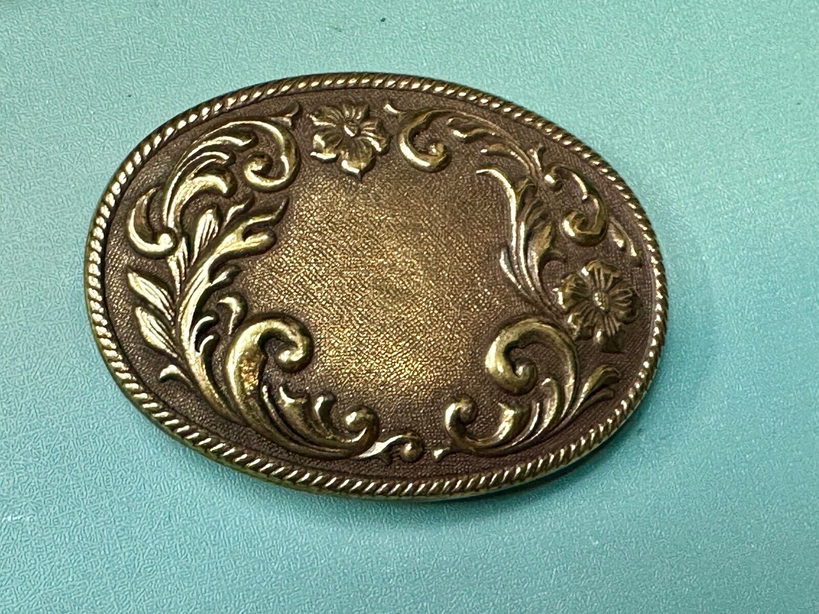 USA made vintage western flower swirl design oval belt buckle marked W