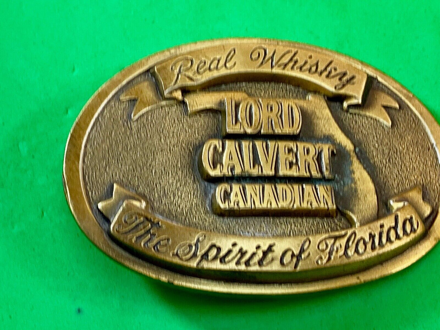Vintage Lord Calvert Canadian Real Whisky.  Spirit Of Florida Belt Buckle 