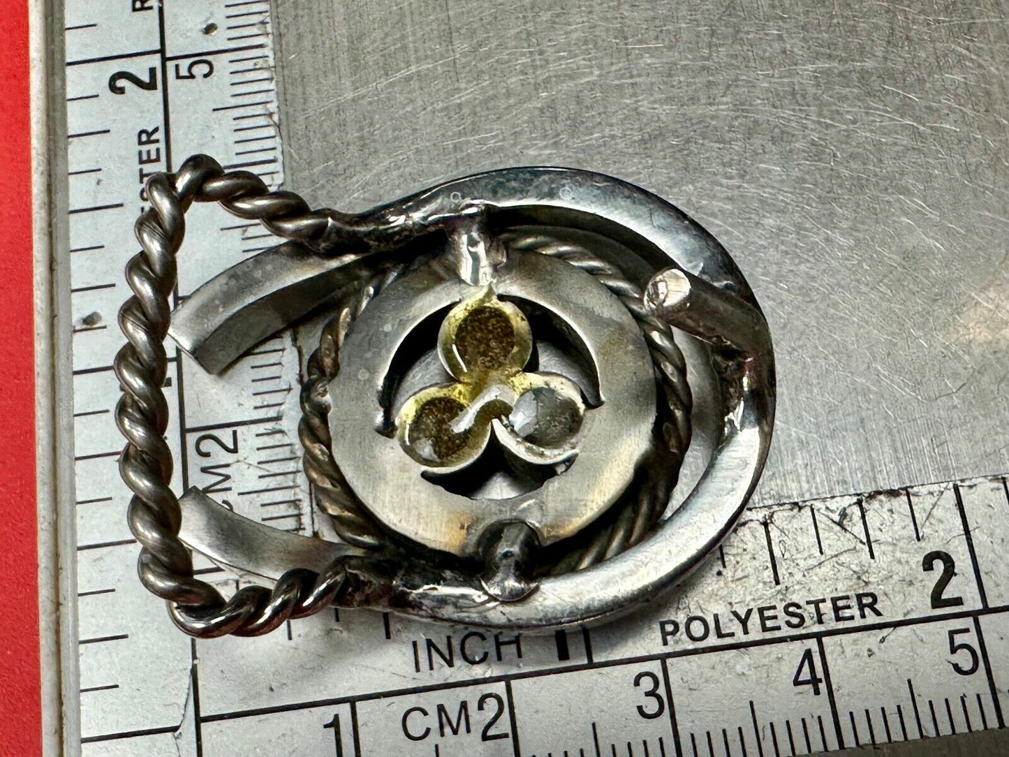 artisan circle pattern rope centerpiece red dots horseshoe shaped belt buckle
