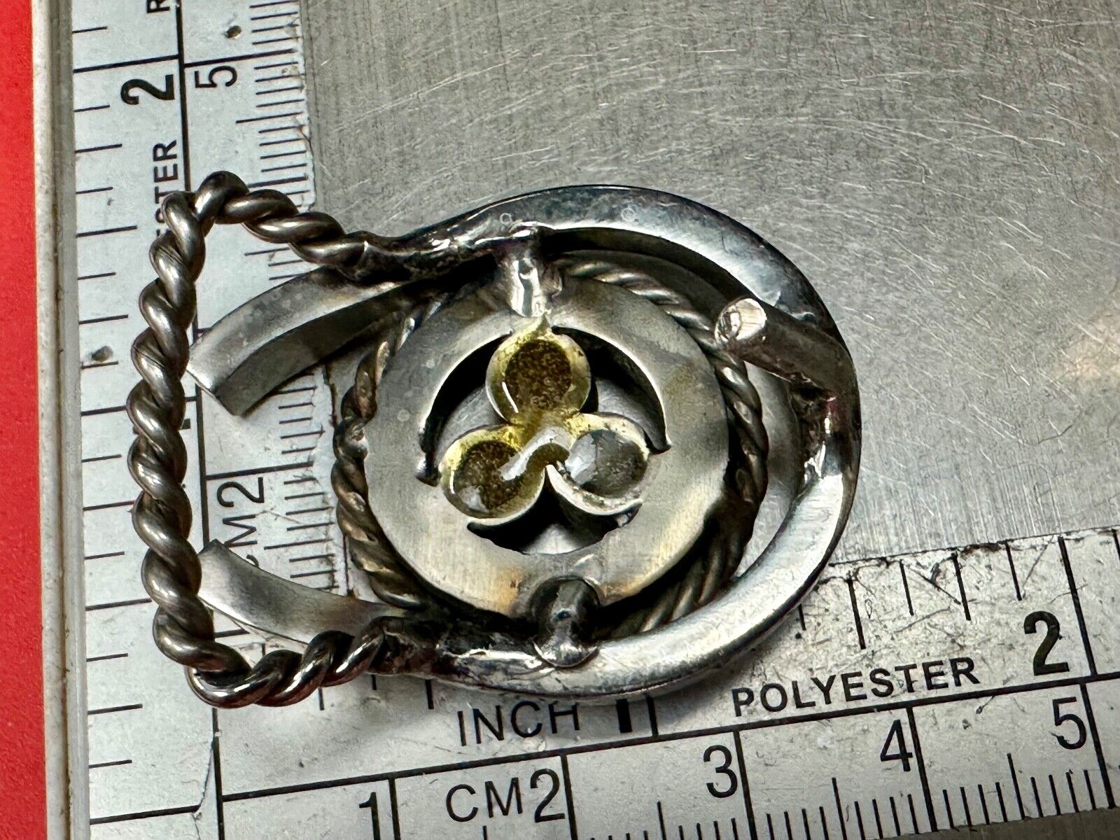 artisan circle pattern rope centerpiece red dots horseshoe shaped belt buckle