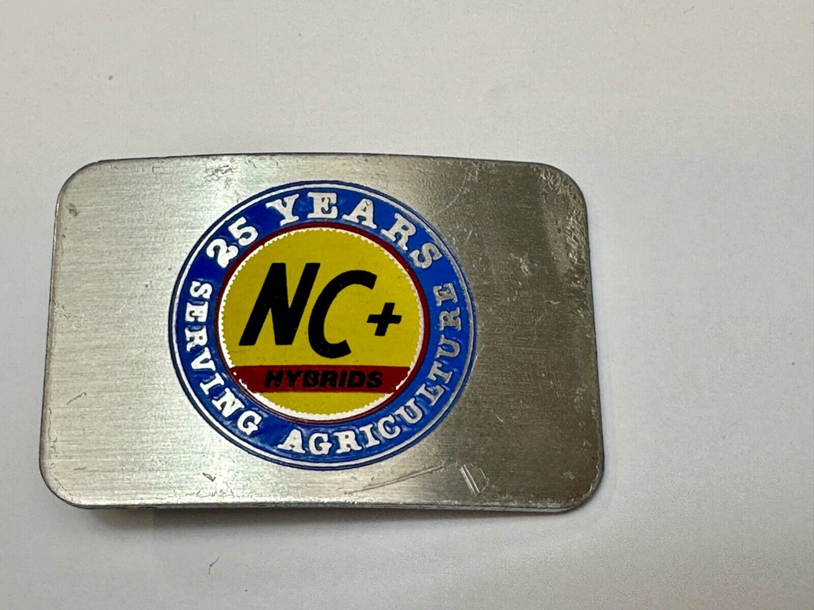 25 years serving agriculture - NC+ Hybrids Farmers Agriculture belt buckle