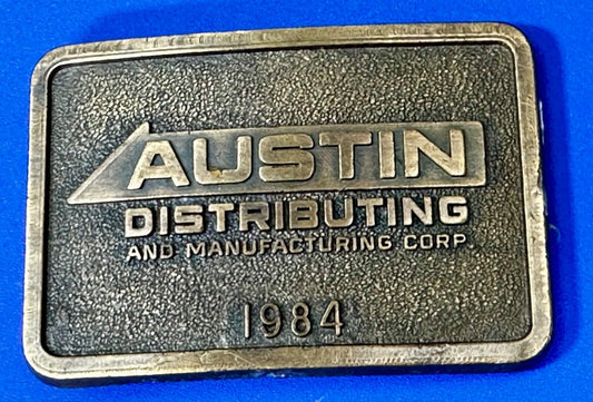 Austin Texas Distributing and Manufacturing 1984 Advertisement Promo Belt Buckle