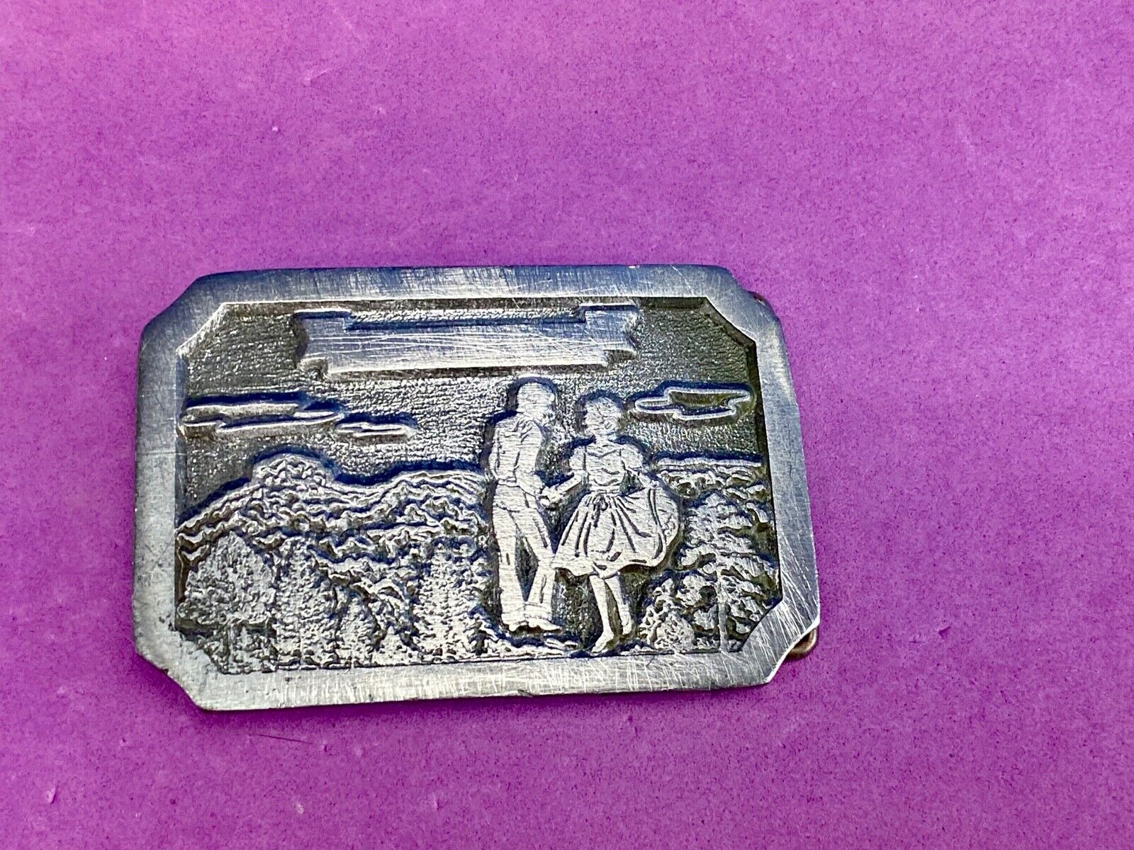 Vintage daleco belt buckle featuring a dancing couple 