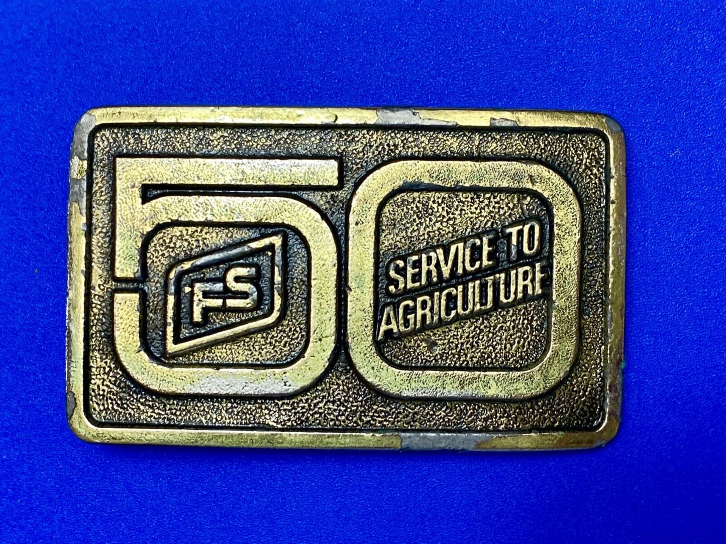 50 years, Farm Service to Agriculture belt buckle by Wyoming Studio Art works