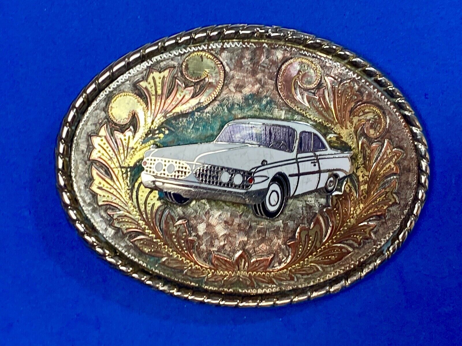 A custom Pimped out retro 70's Car - a caddy? on a western belt buckle signed W!