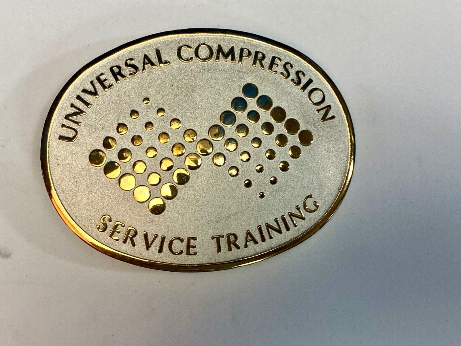 Universal Compression Service Training Company Award Belt Buckle