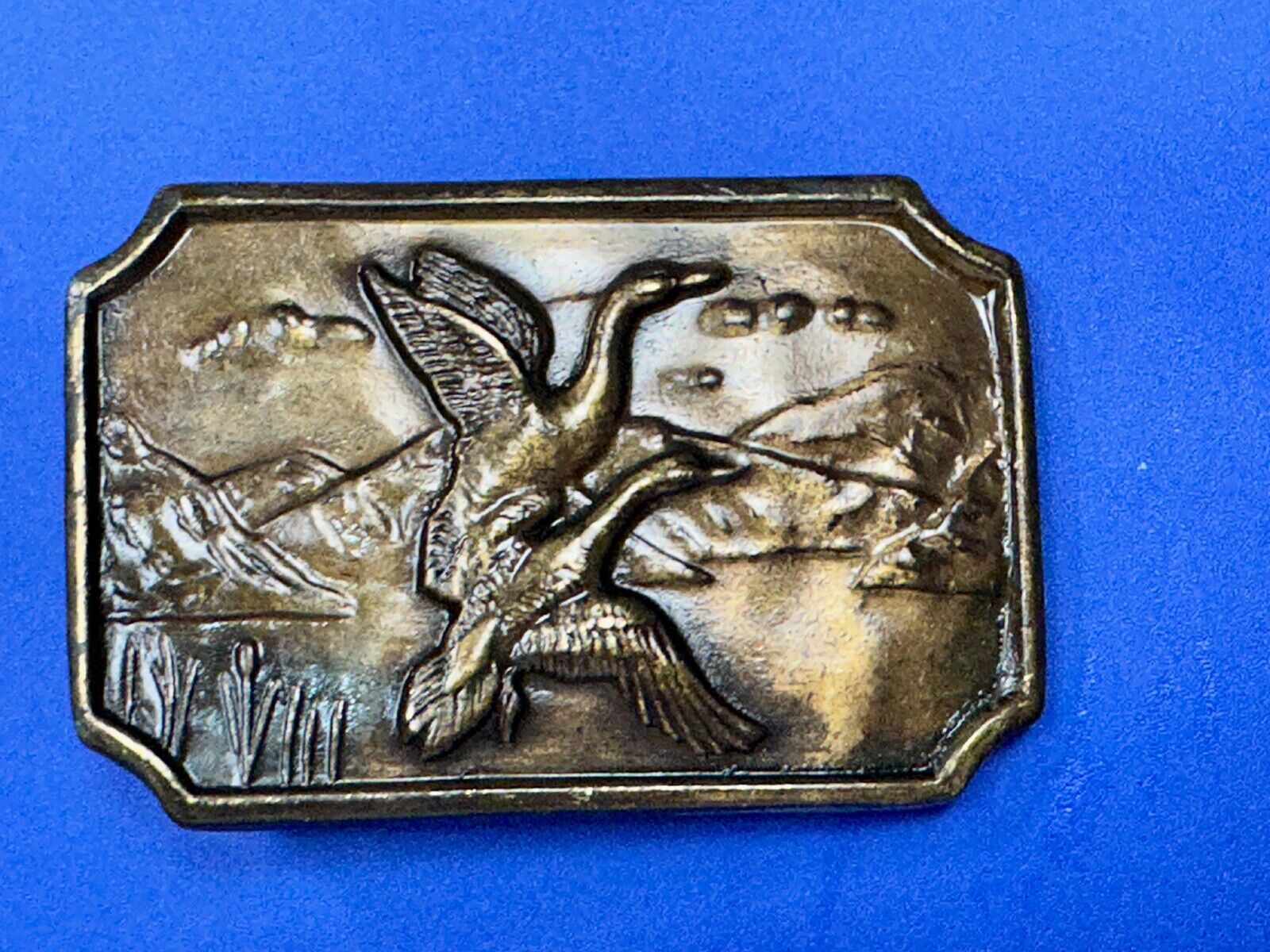Two ducks flying from pond - Vintage nature scene belt buckle
