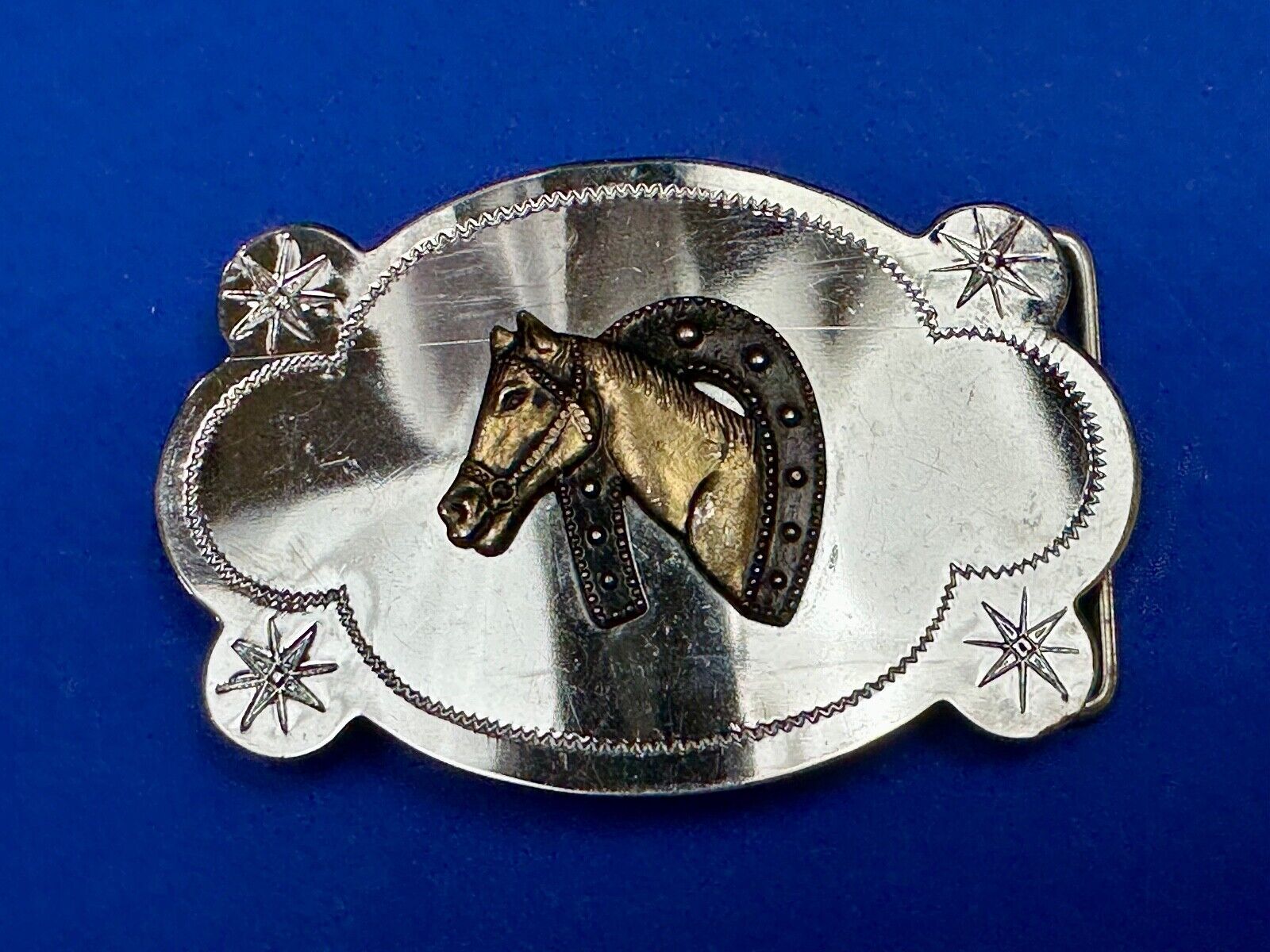 Vintage horse head in horseshoe cowboys cowgirls western belt buckle starbursts