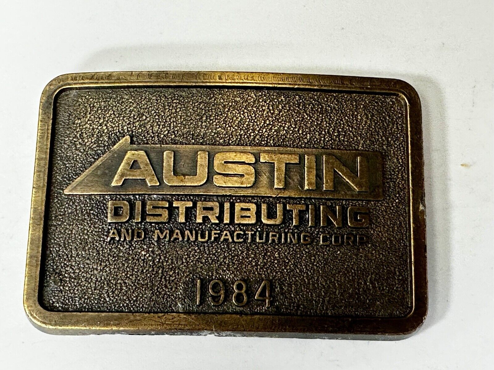 Austin Texas Distributing and Manufacturing 1984 Advertisement Promo Belt Buckle