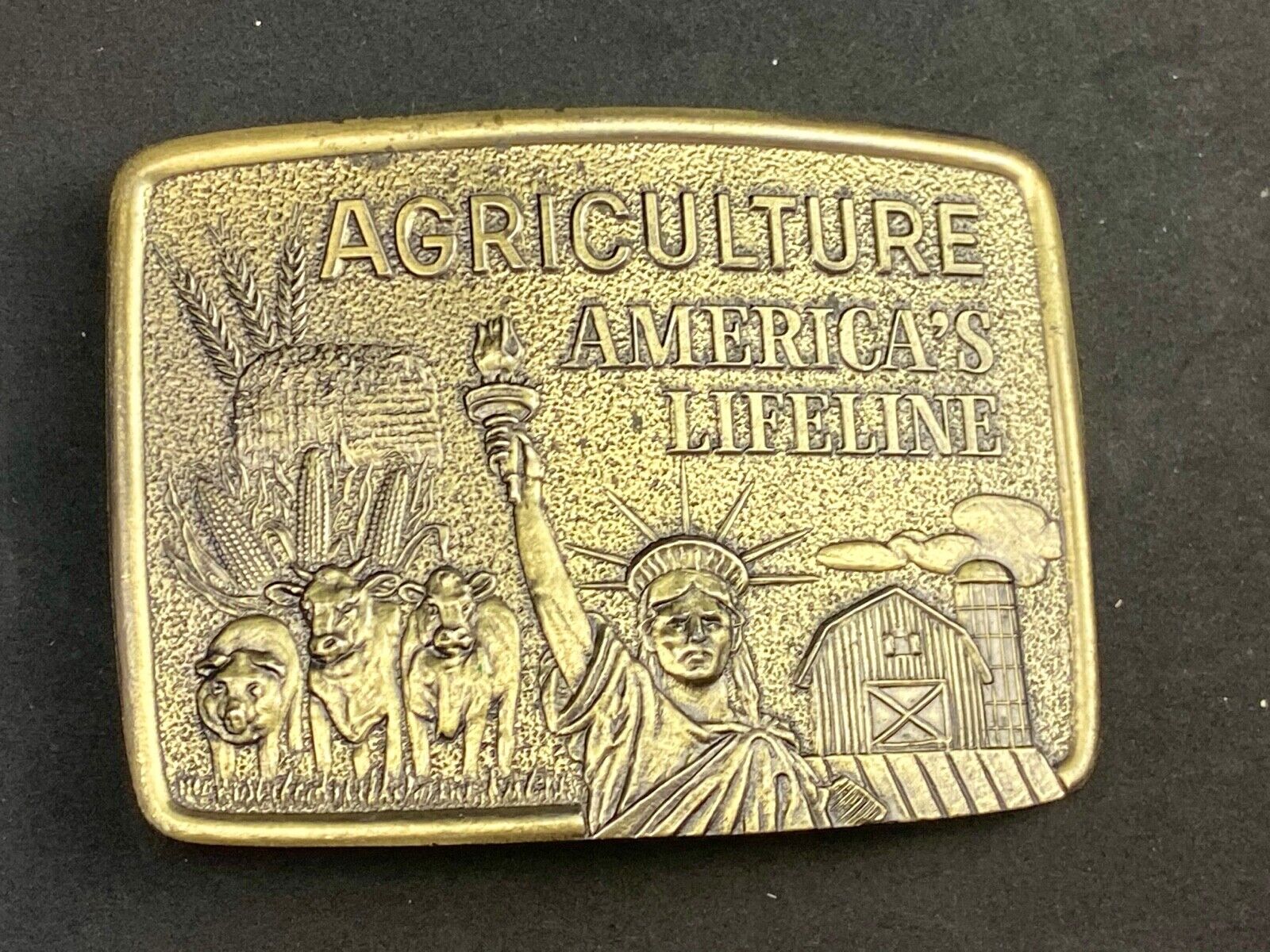 AGRICULTURE, Americas Lifeline belt buckle by Farmhand Statue of liberty 