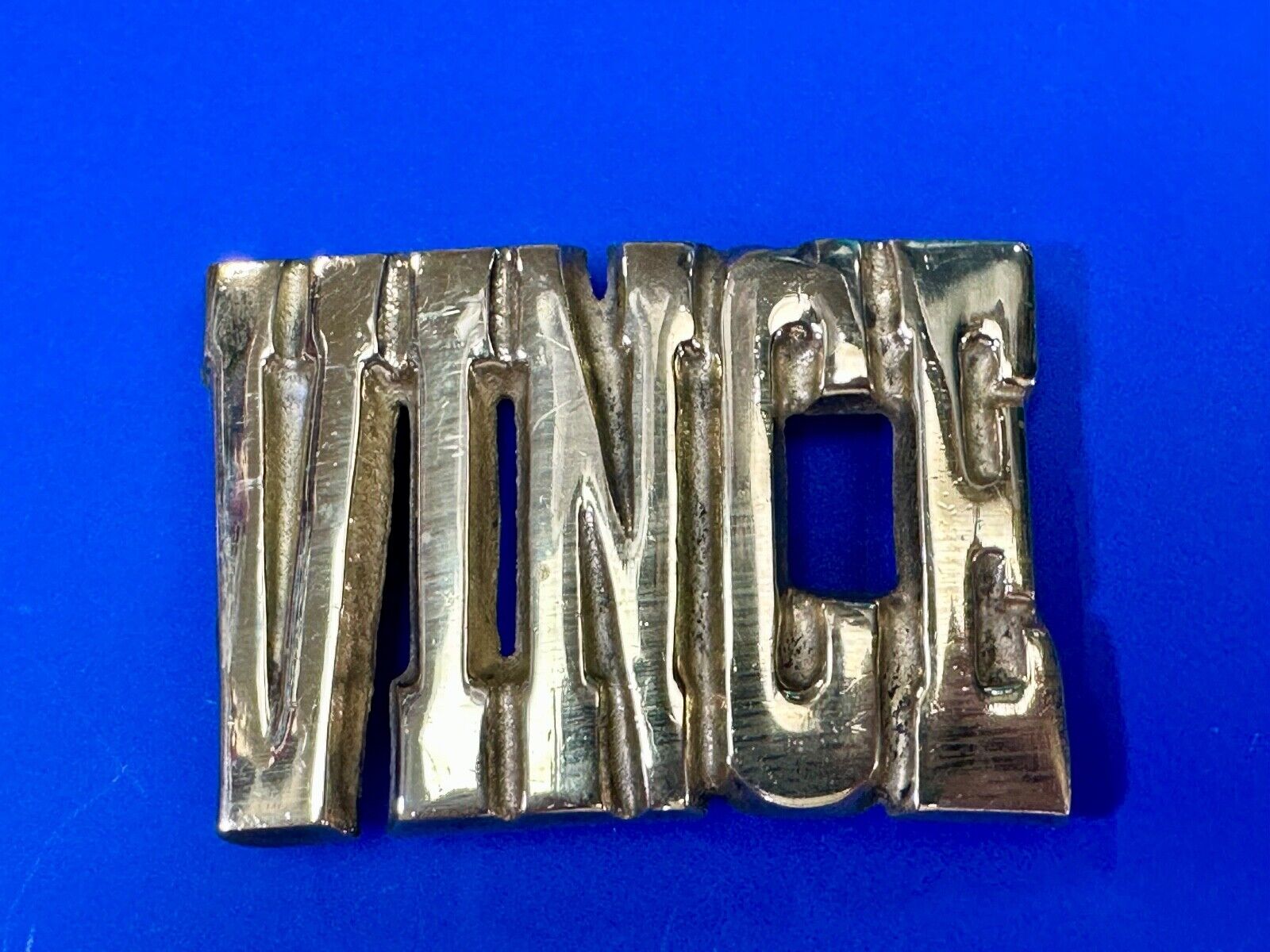 Vince,  Cutout block letters solid brass Vintage belt buckle marked Taiwan ROC