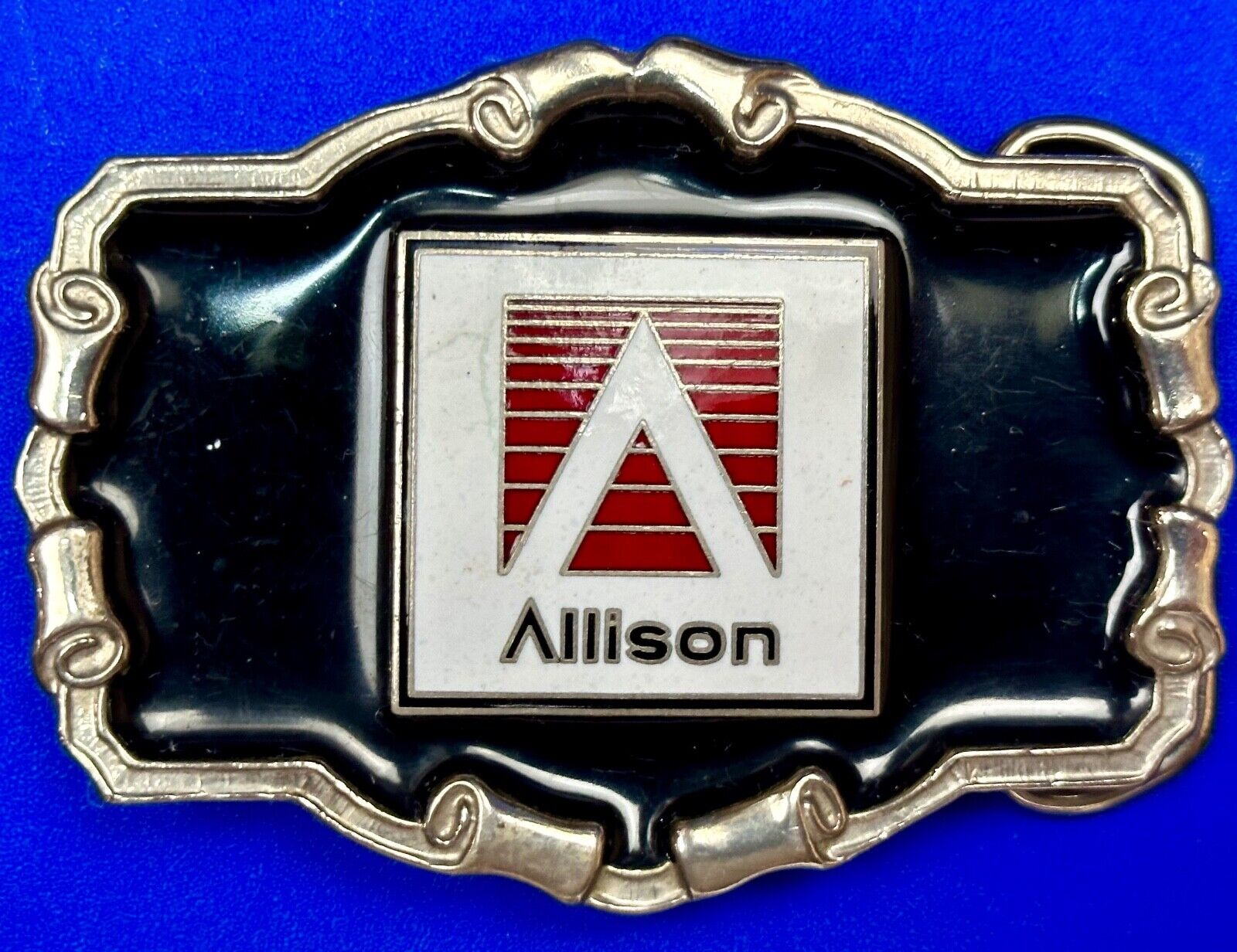 Allison Company logo emblem on western framed black enameled belt buckle