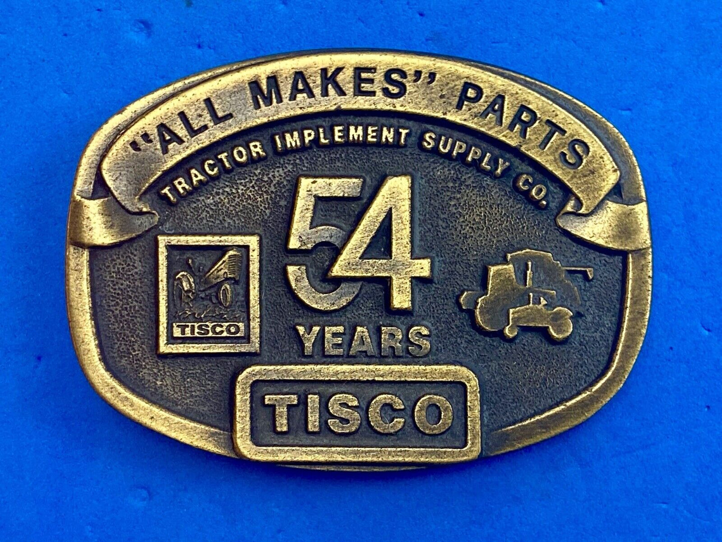 54 years Tisco Tractor Implement Supply Spec Cast Brass Belt Buckle series 2