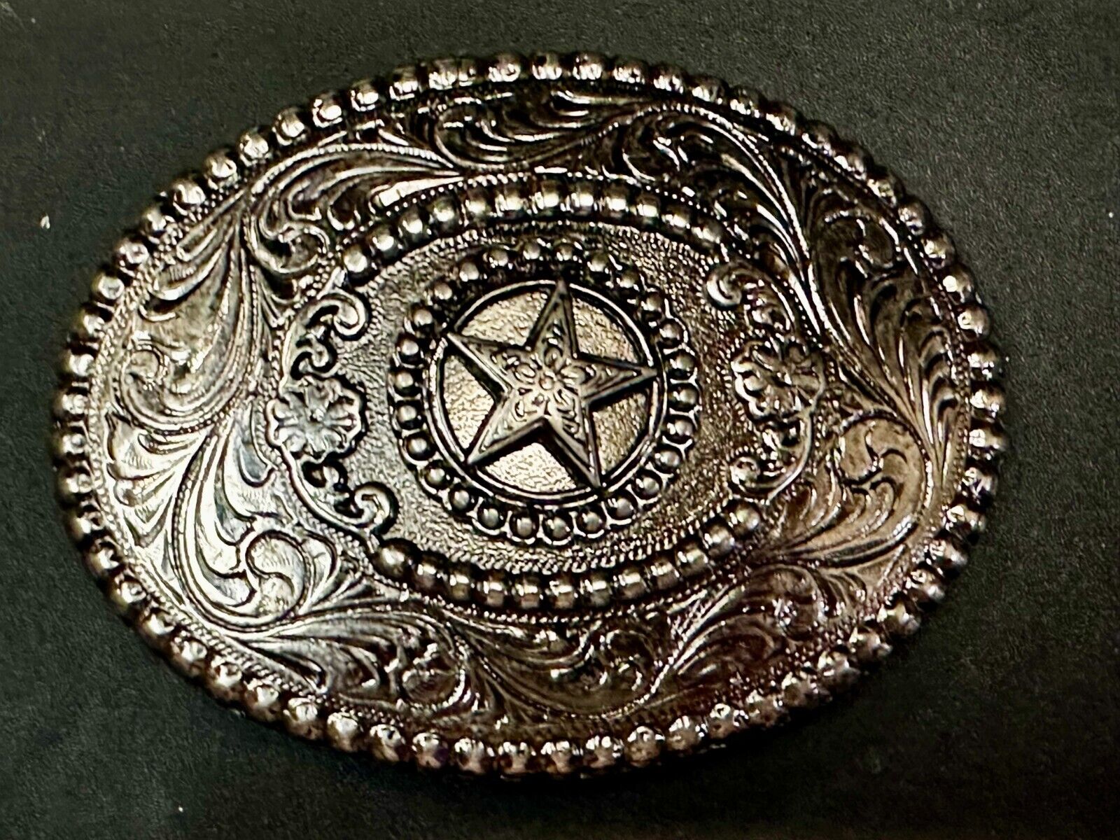 The Lone Star Centered In Oval Flower Swirl Silver Tone Belt Buckle
