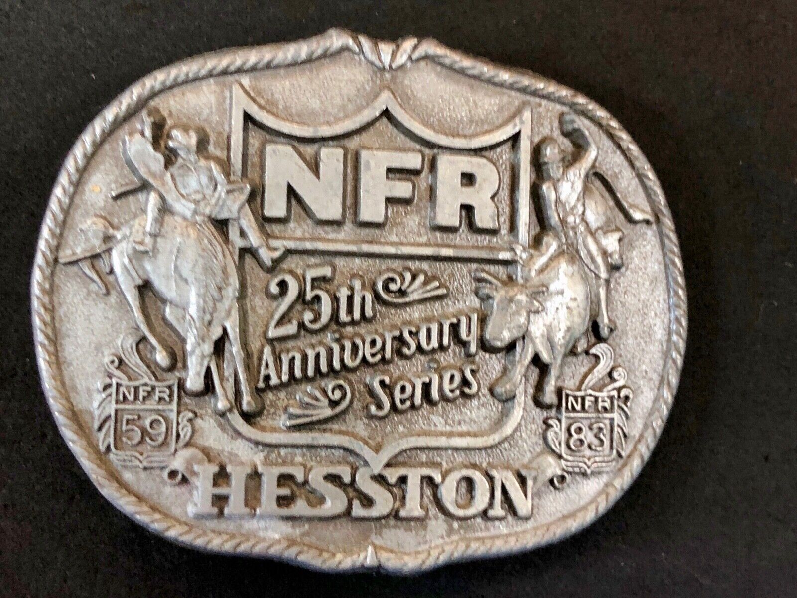 25th Anniversary 1959-1983 Hesston National Finals Rodeo belt buckle FIRST EDN.