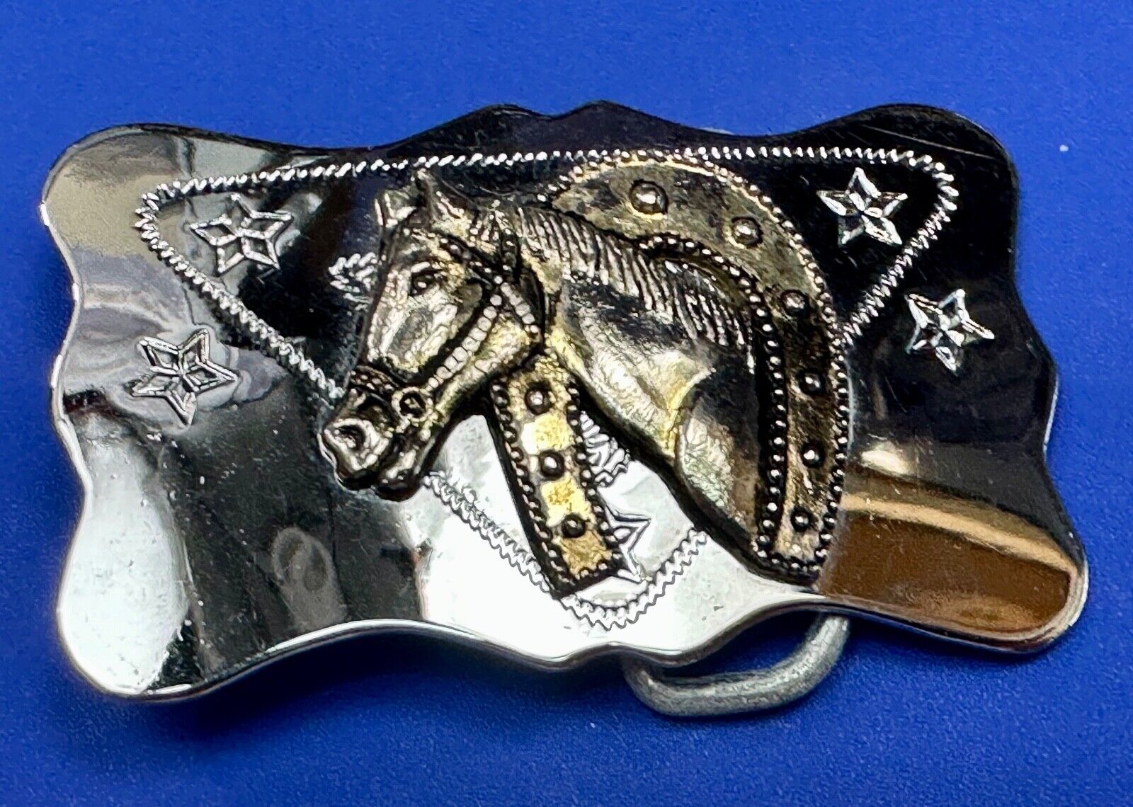 Vintage horse head through lucky horseshoe on reflective western belt buckle