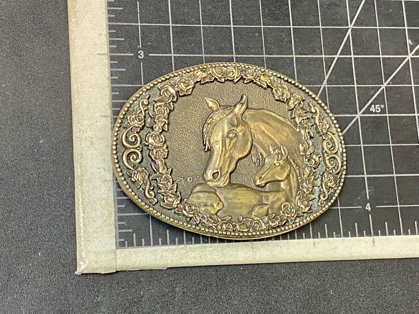 Two horse heads First addition brass belt buckle by Award Design Medals